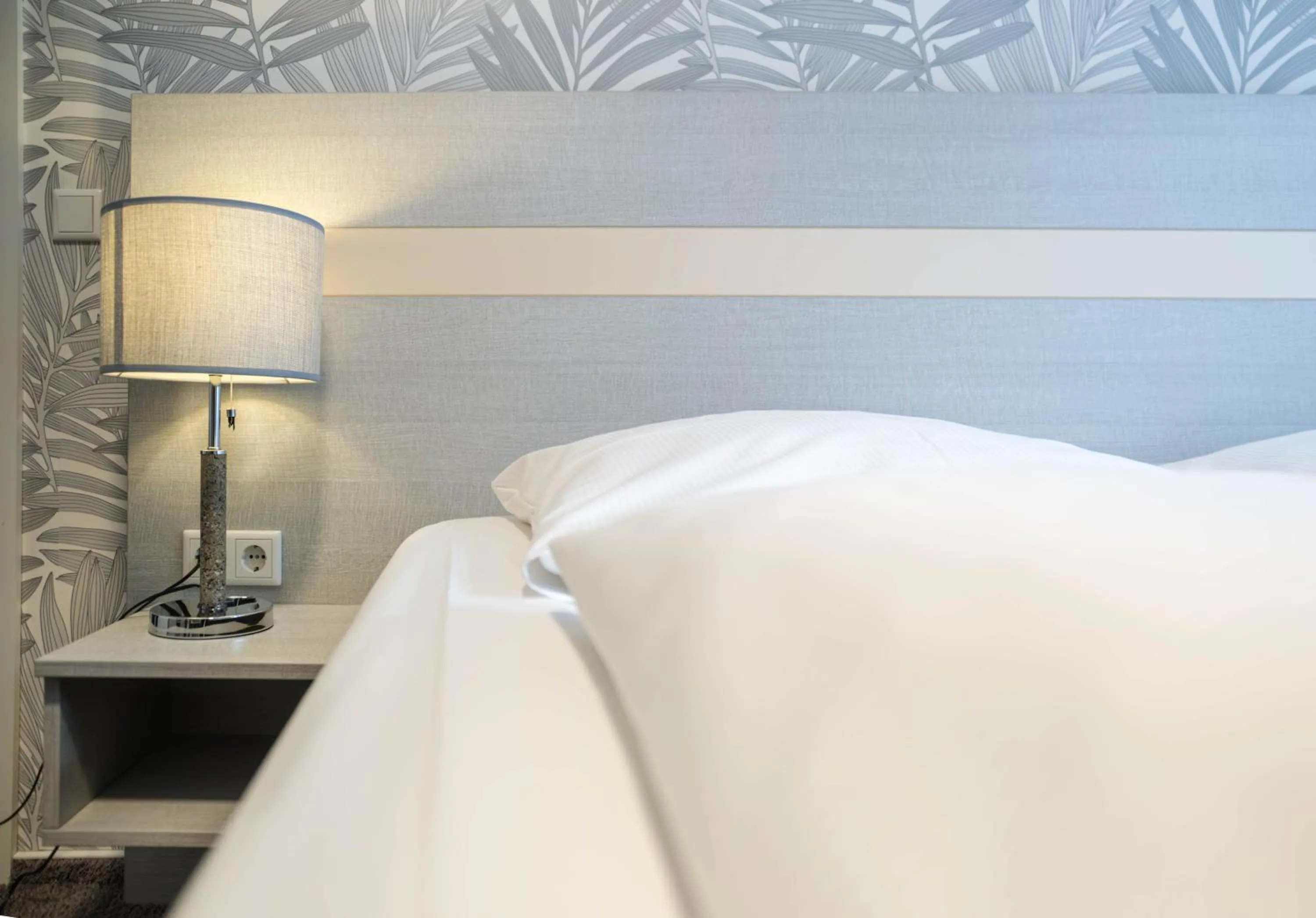 Photo of the whole room, Bed in Hotel des Nordens Flensburg Wellness & Spa