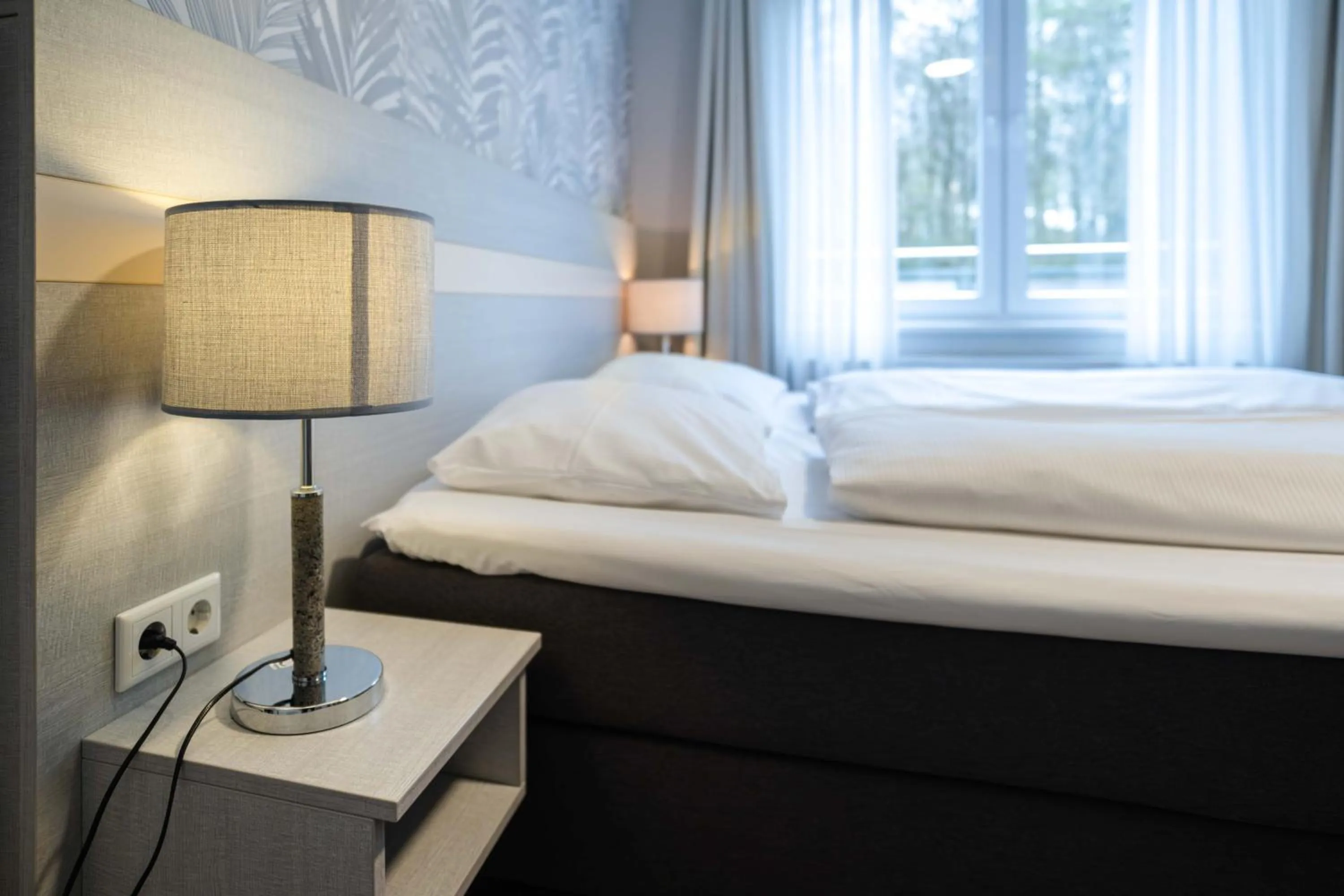 Photo of the whole room, Bed in Hotel des Nordens Flensburg Wellness & Spa