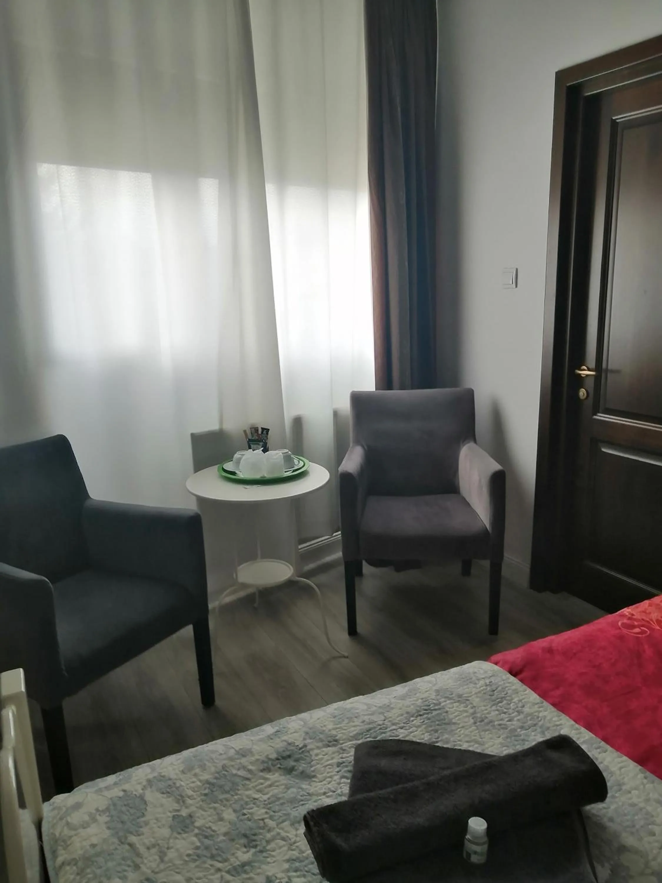 Seating area, Bed in Bizant Boutique