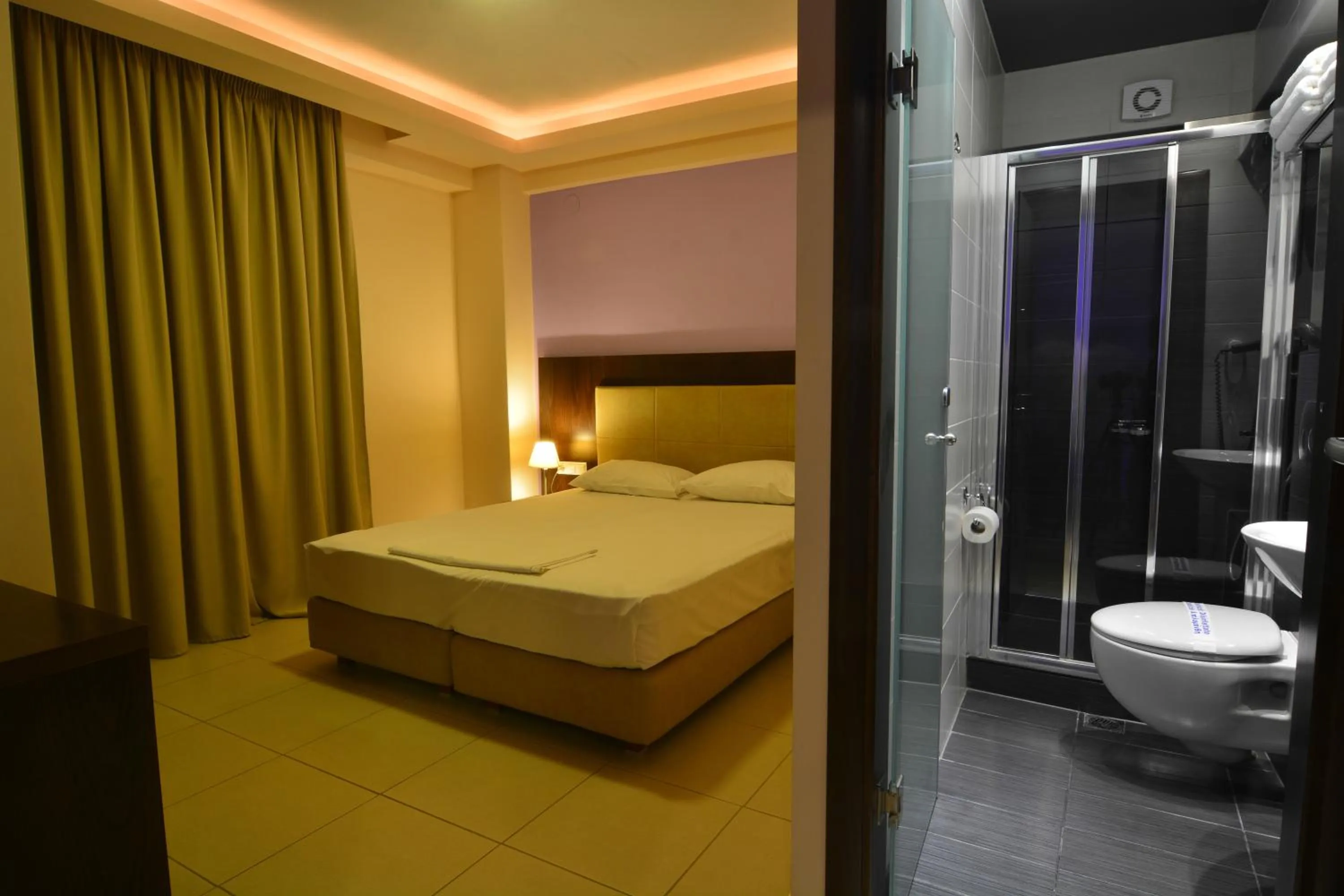 Bed in Panorama Inn Hotel