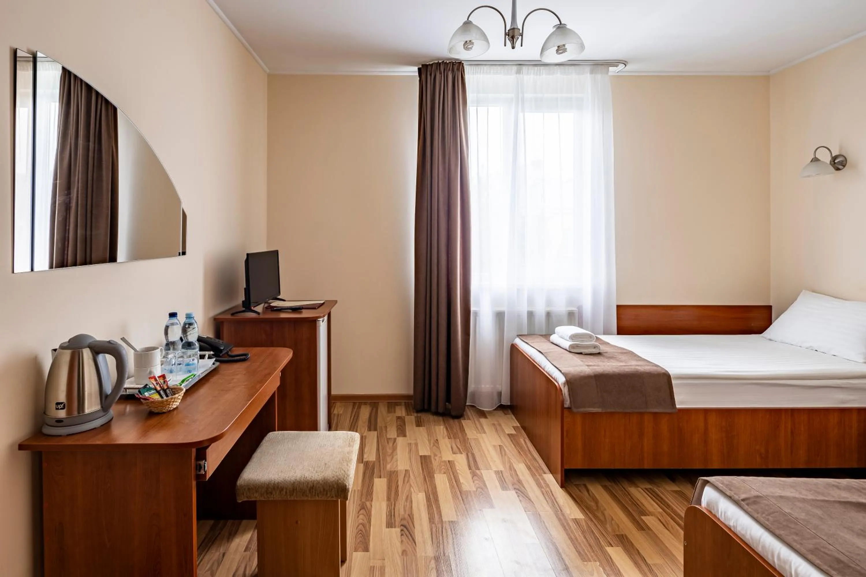 Seating area, Bed in Hotel Galaktika