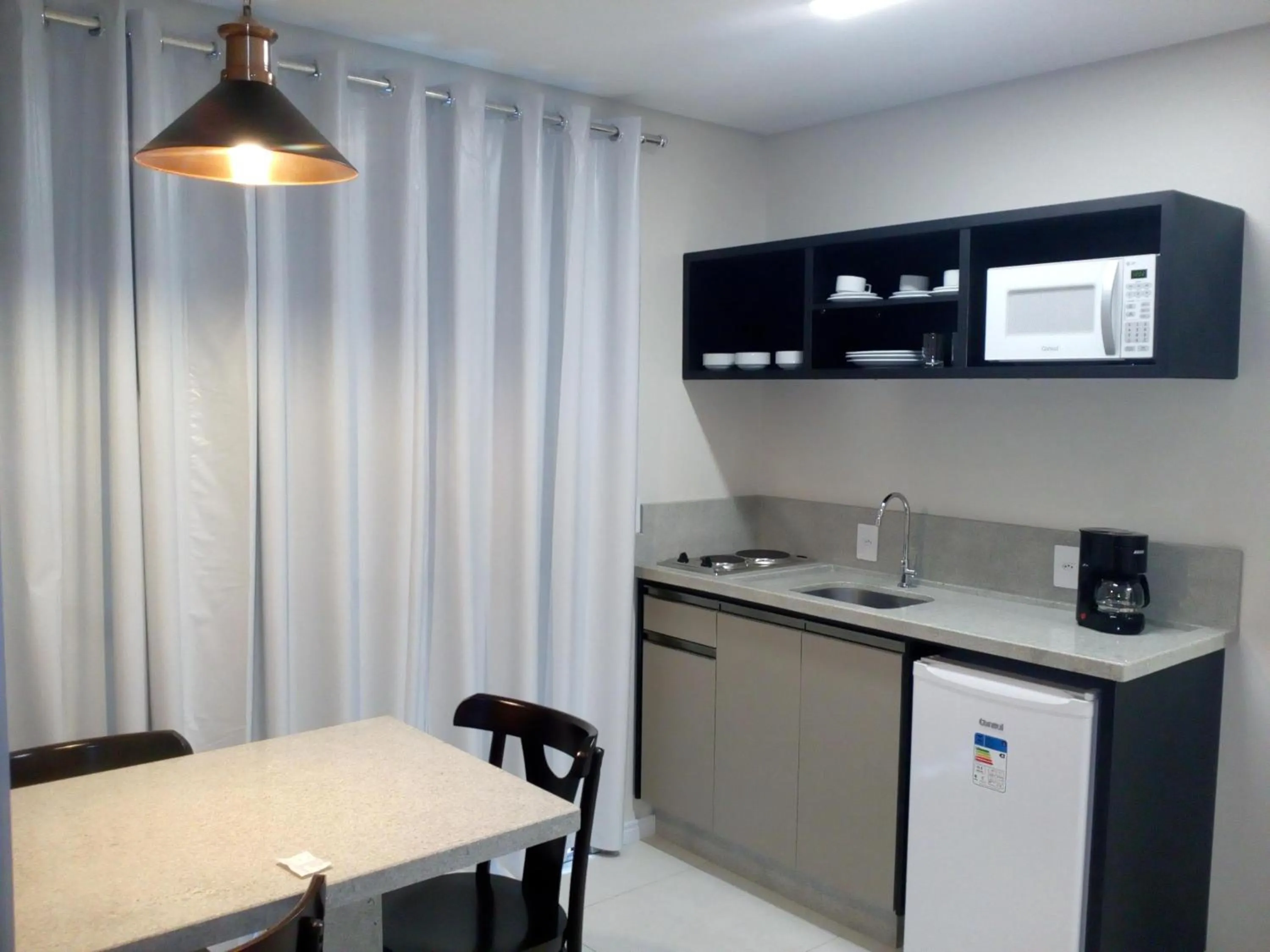 Kitchen or kitchenette in Belluno Apart Hotel
