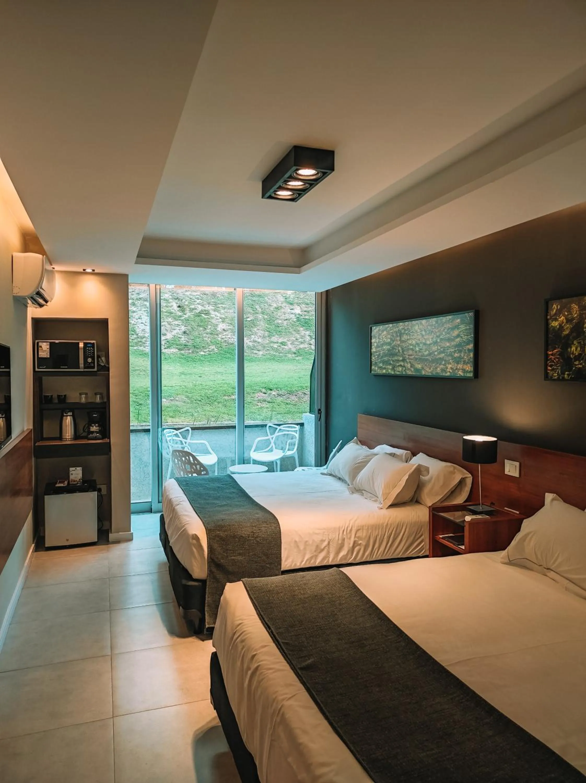 Bed in Pinares del Cerro Resort & Suites
