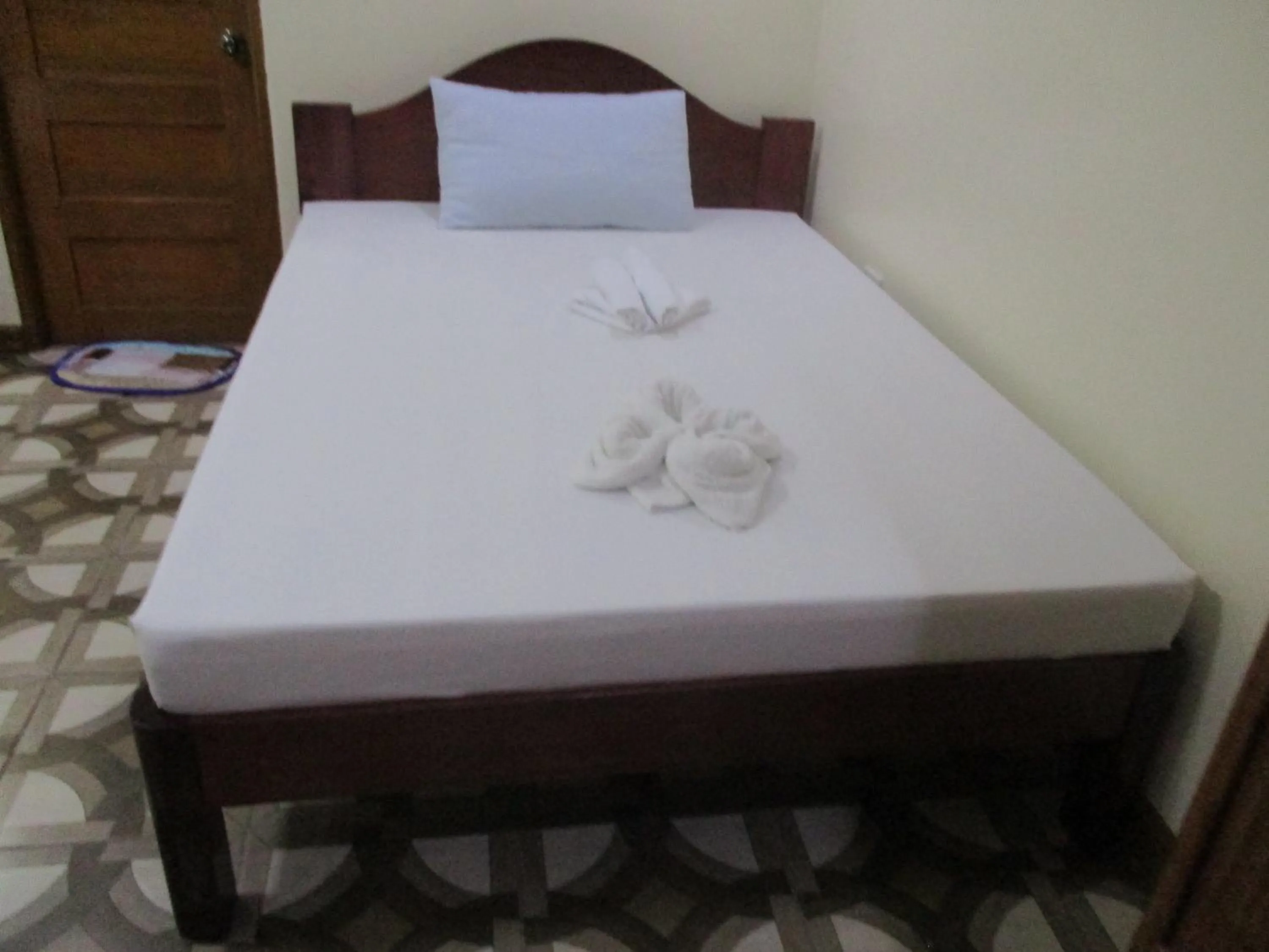 Bed in WMV Hotel & Restaurant