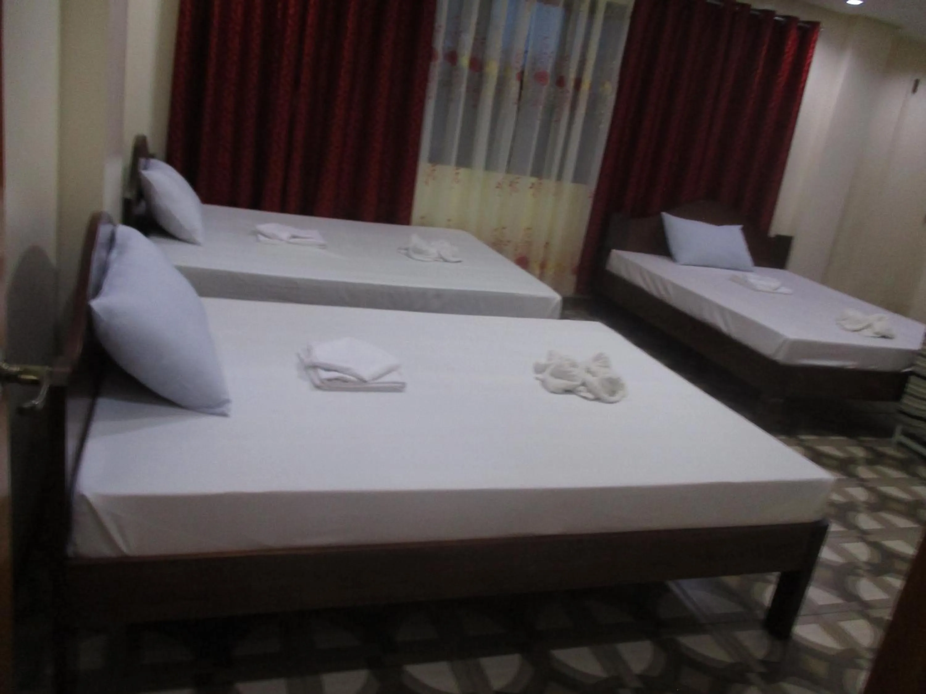 Bed in WMV Hotel & Restaurant