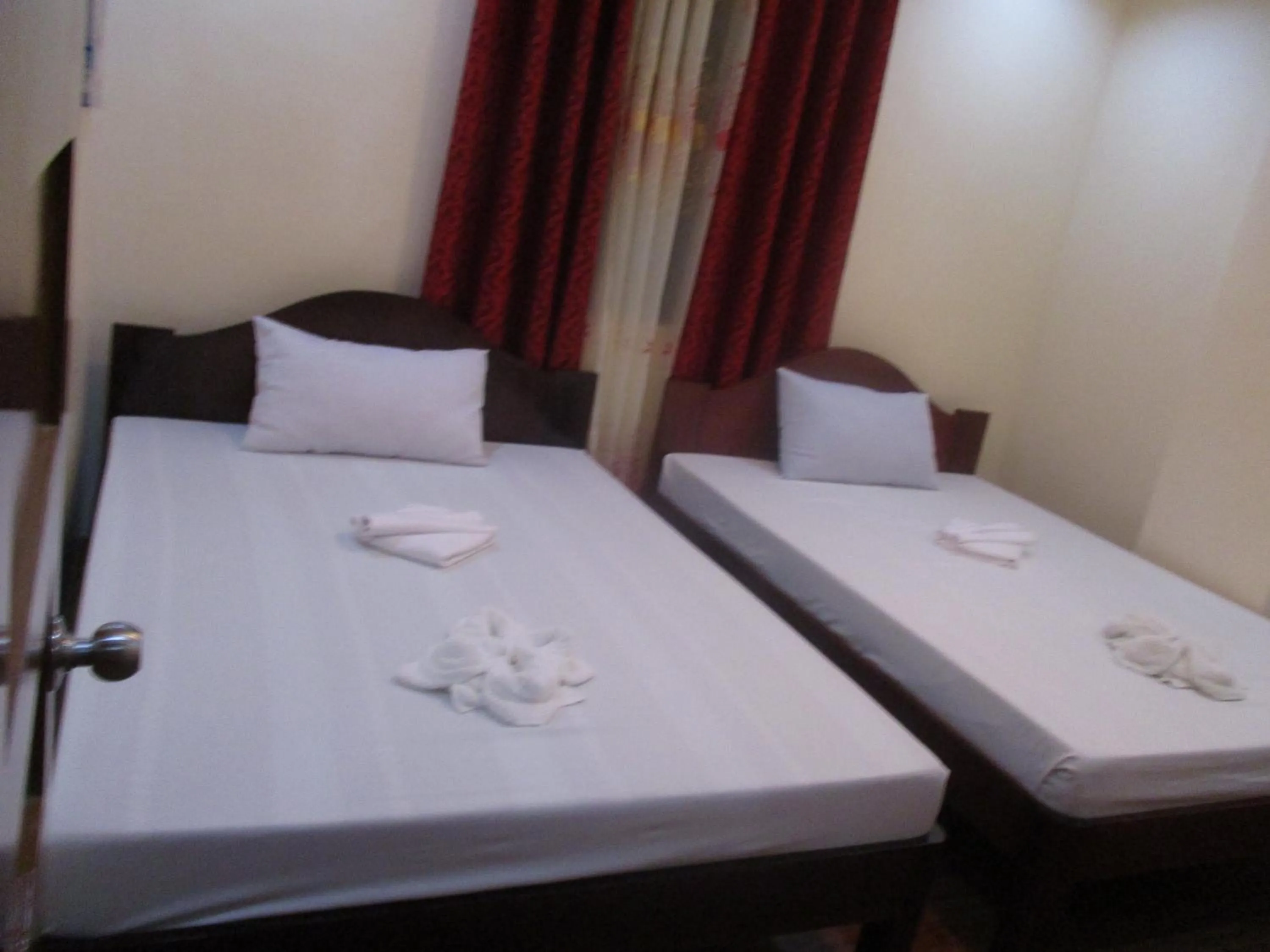 Bed in WMV Hotel & Restaurant