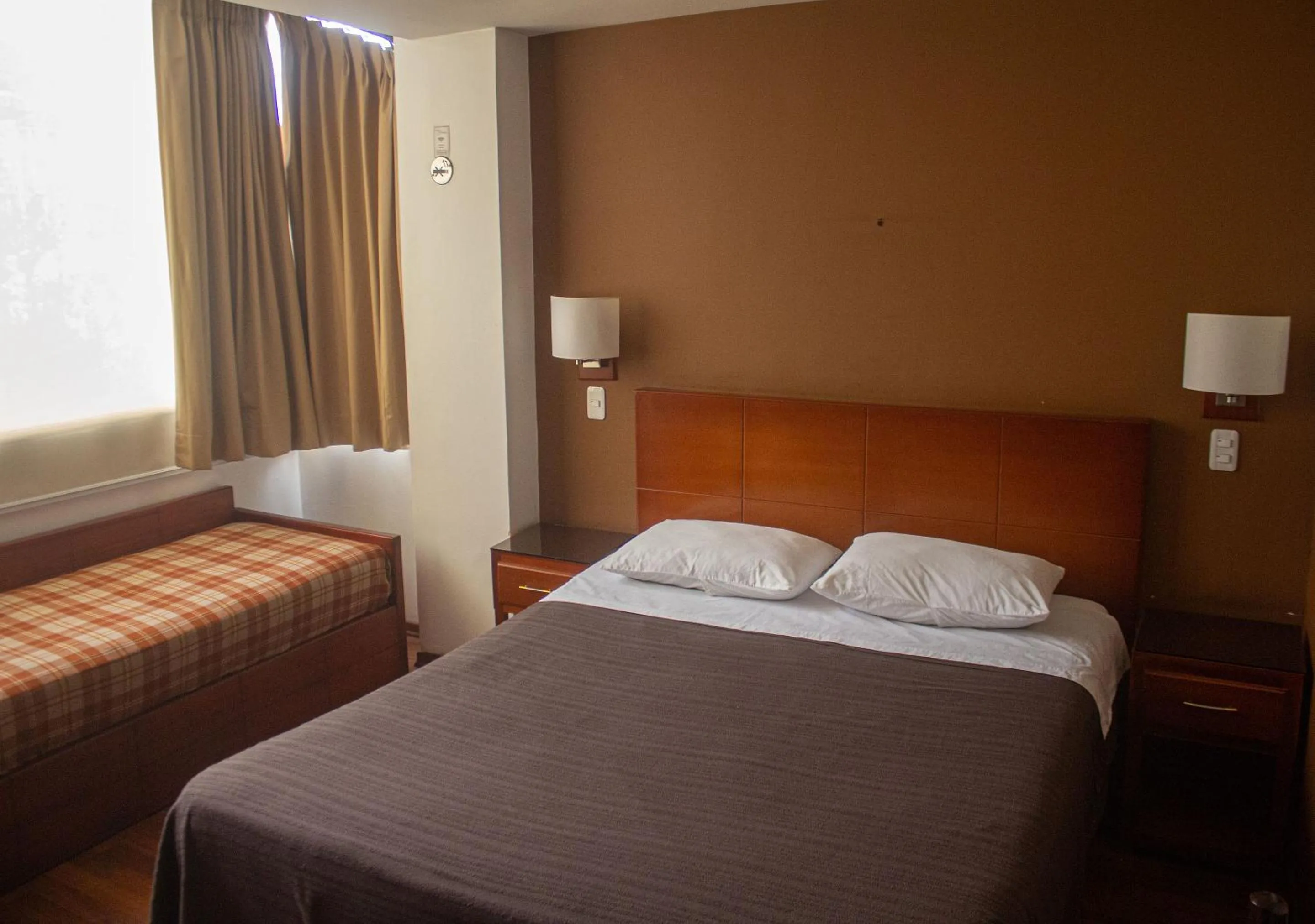 Bed in Filatelia Suites & Travel