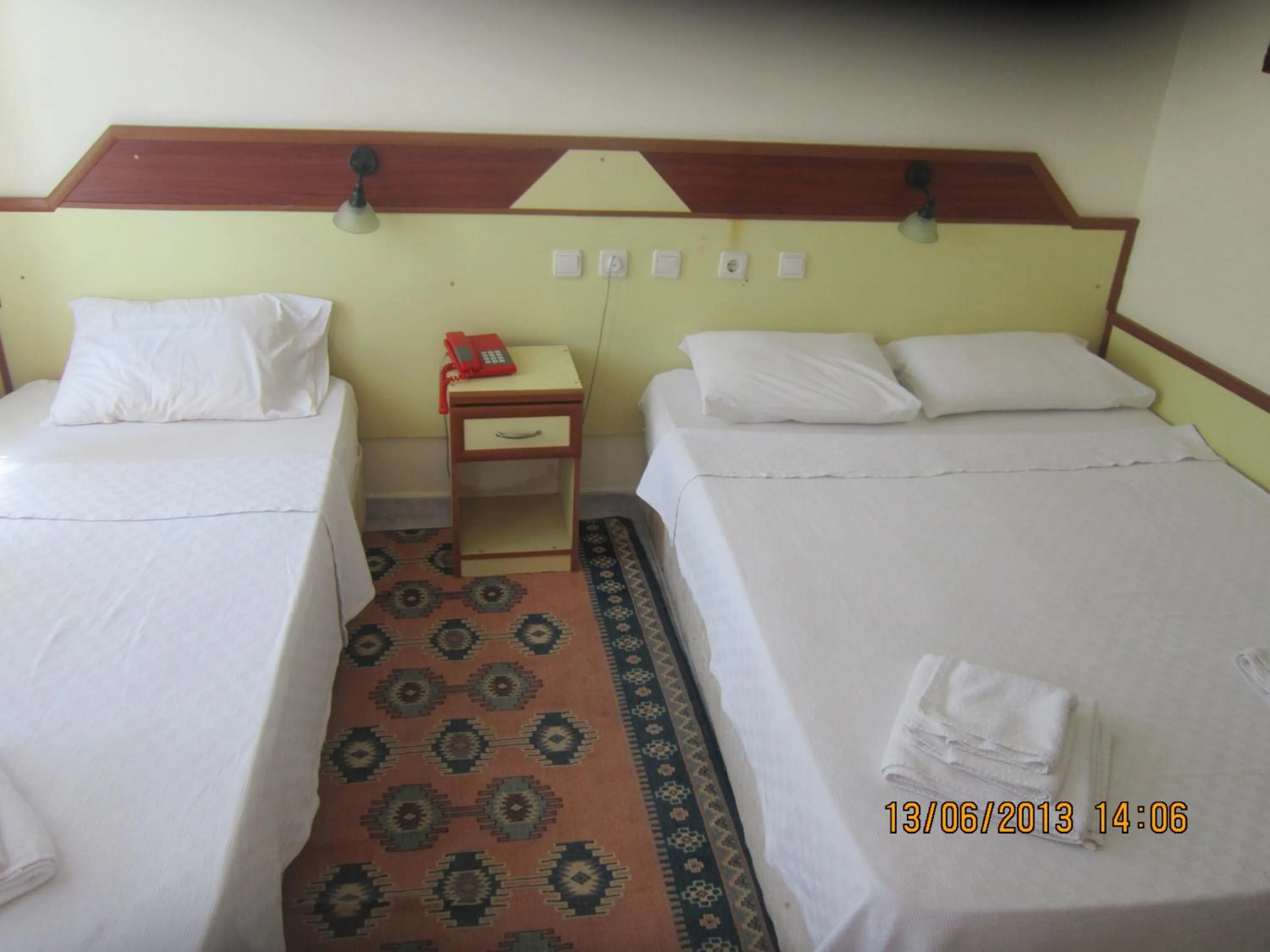 Bed in Red Rose Hotel