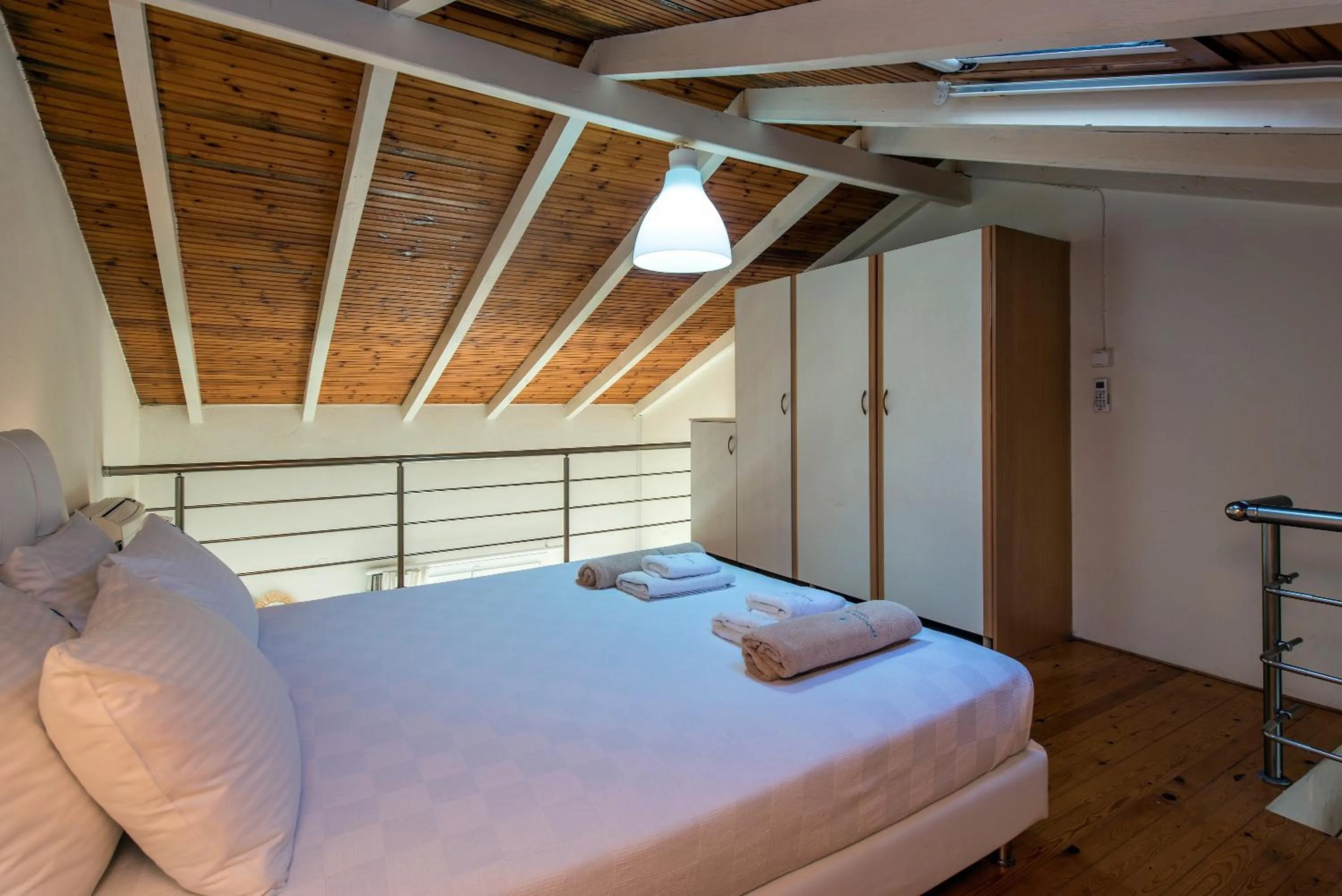 Bed in Krouzeri Beach Apartments