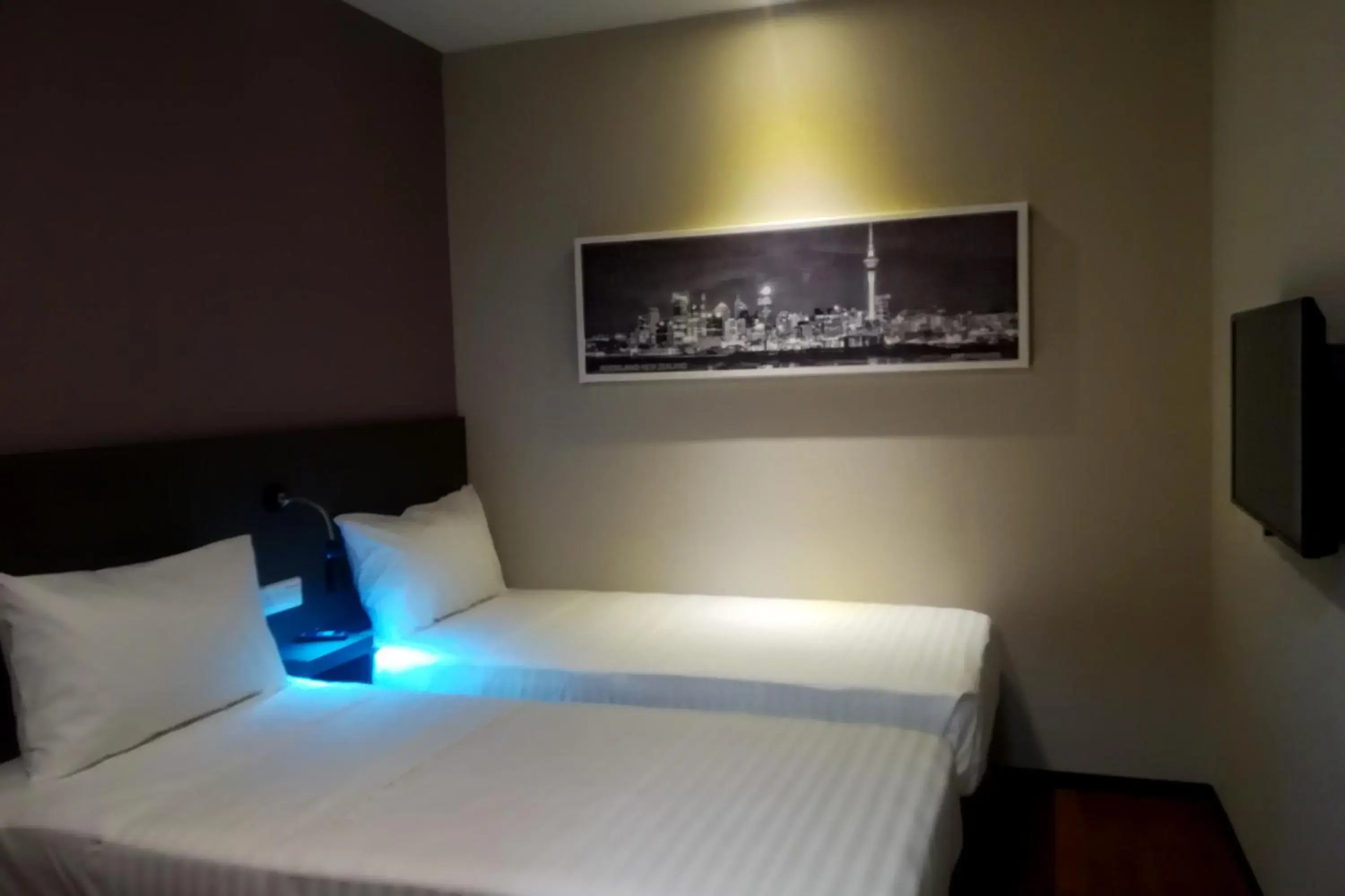 Bed in The Loft Plaza Hotel Bed in The Loft Plaza Hotel