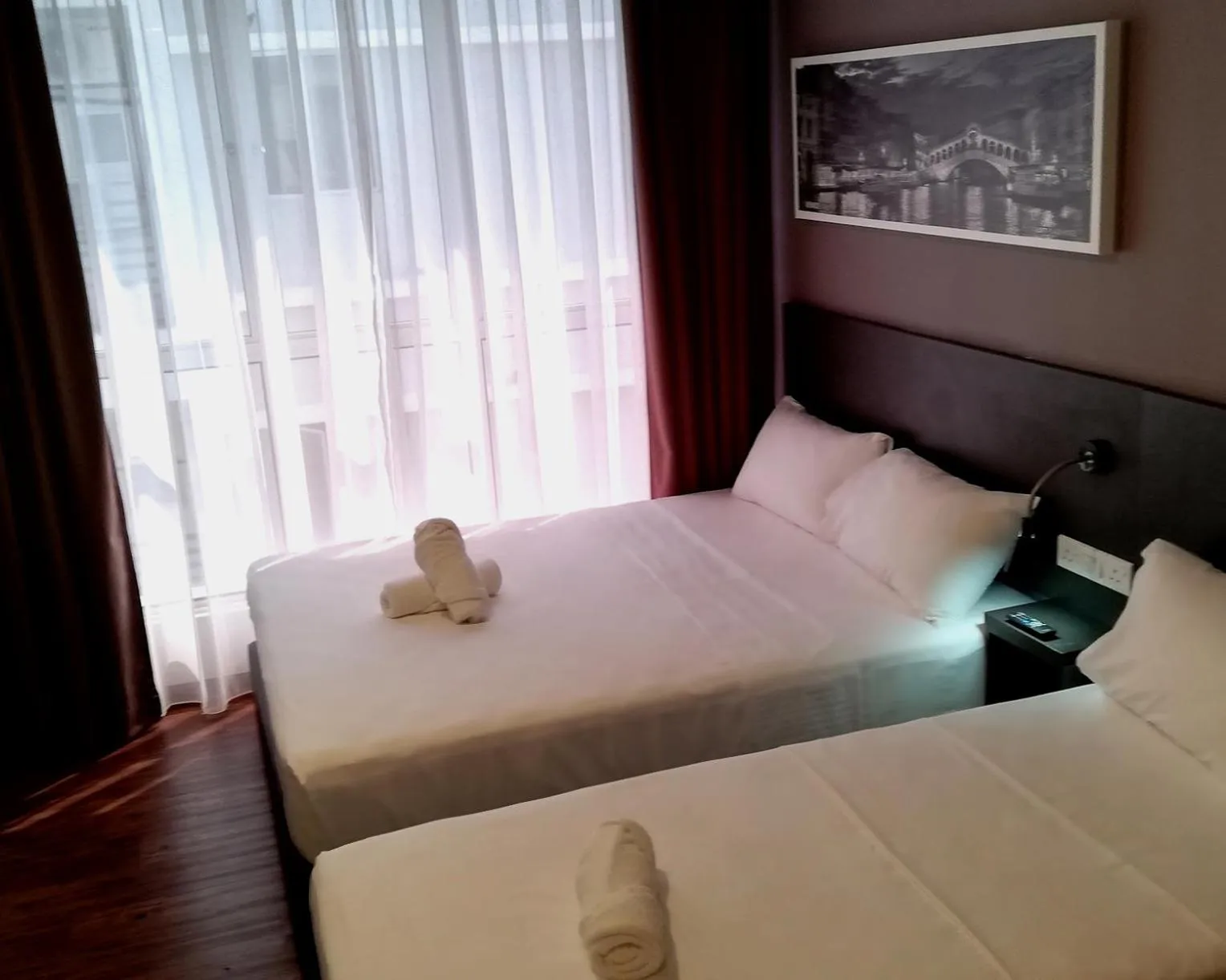 Bed in The Loft Plaza Hotel