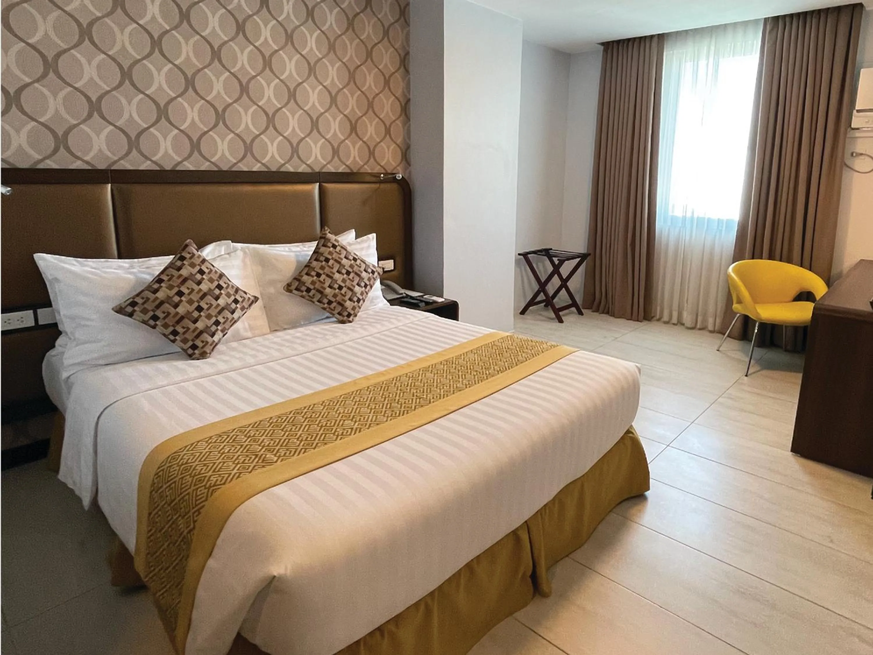 Bedroom, Bed in One Central Hotel & Suites