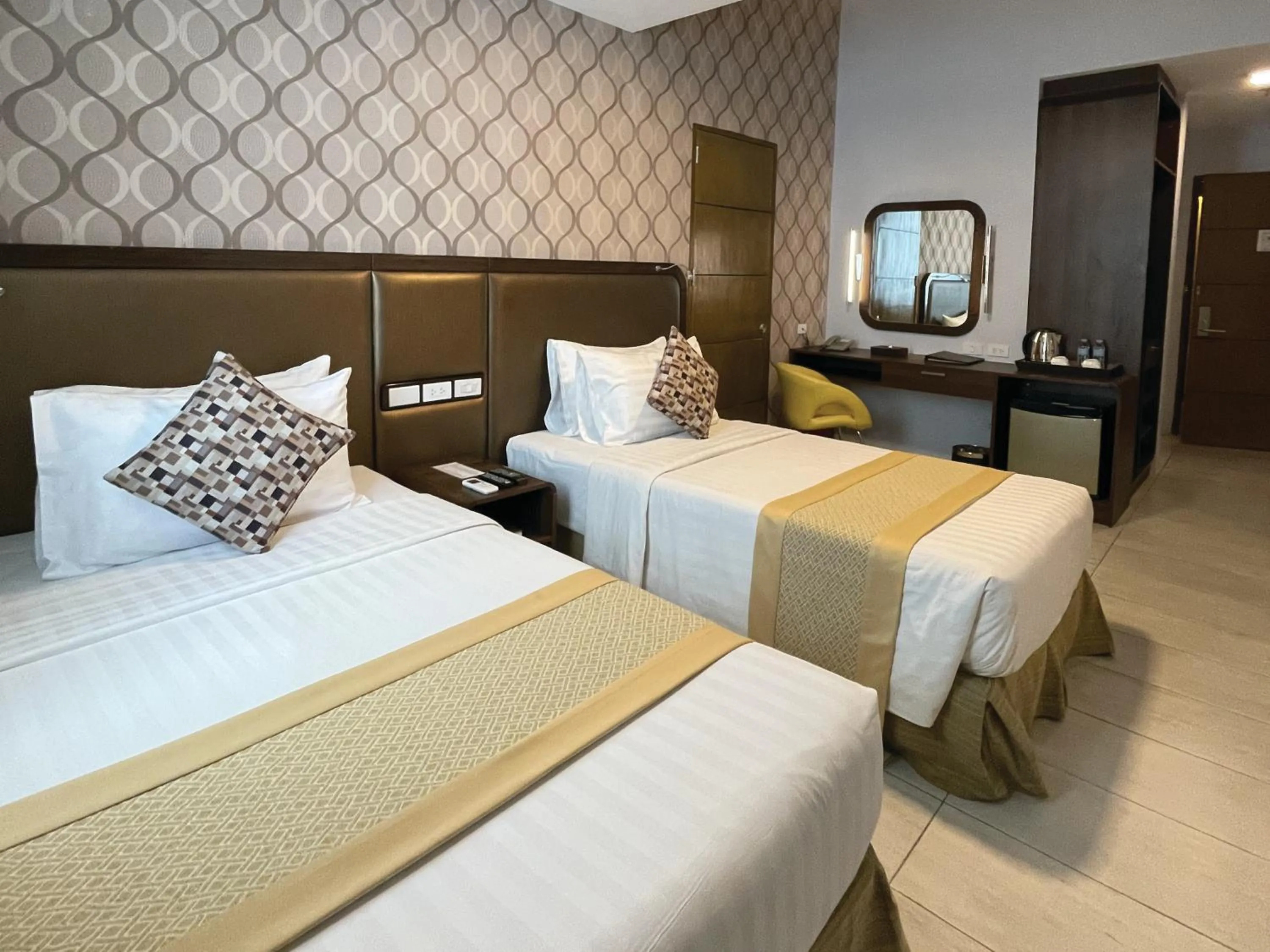 Bedroom, Bed in One Central Hotel & Suites