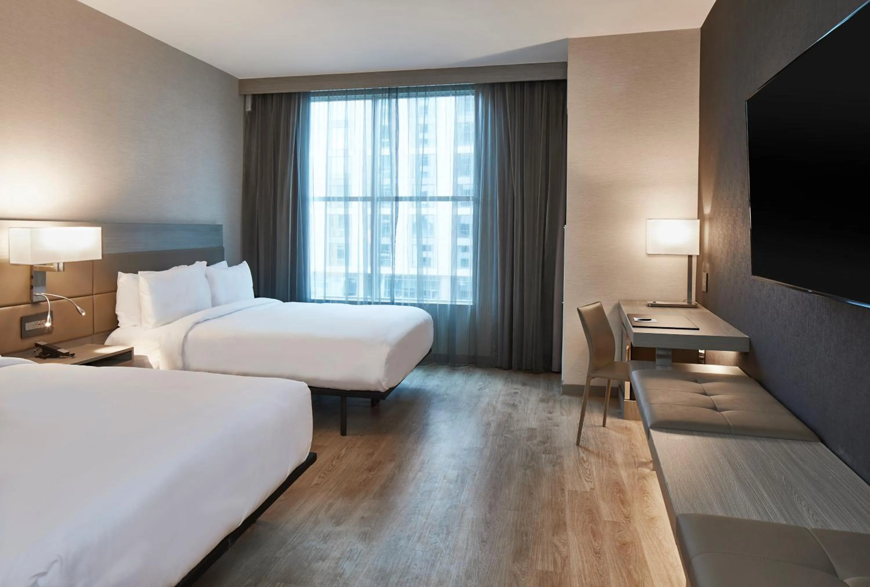 Bed in AC Hotel Nashville Downtown