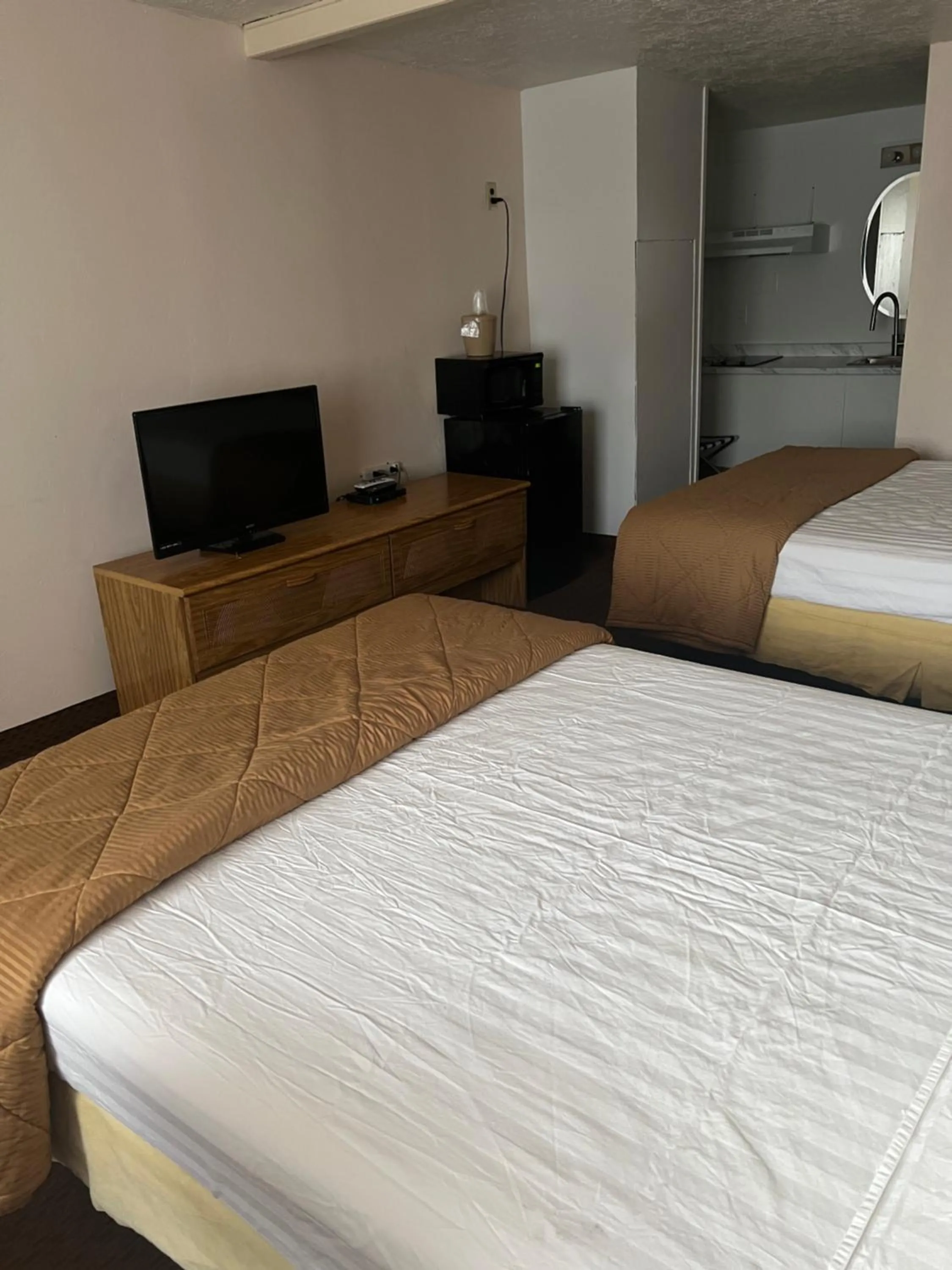 Bed in Prospector Motor Lodge