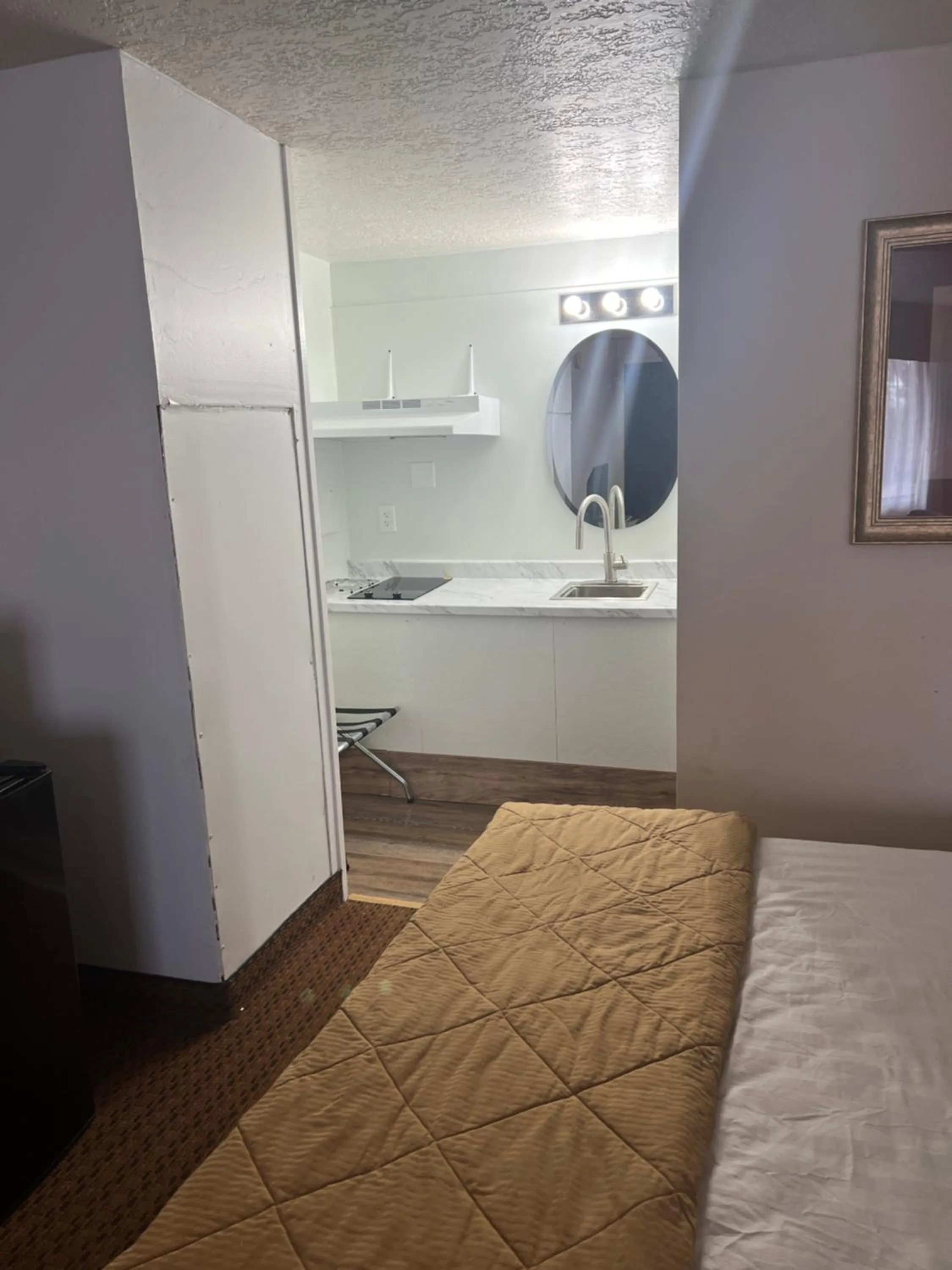 Bed in Prospector Motor Lodge