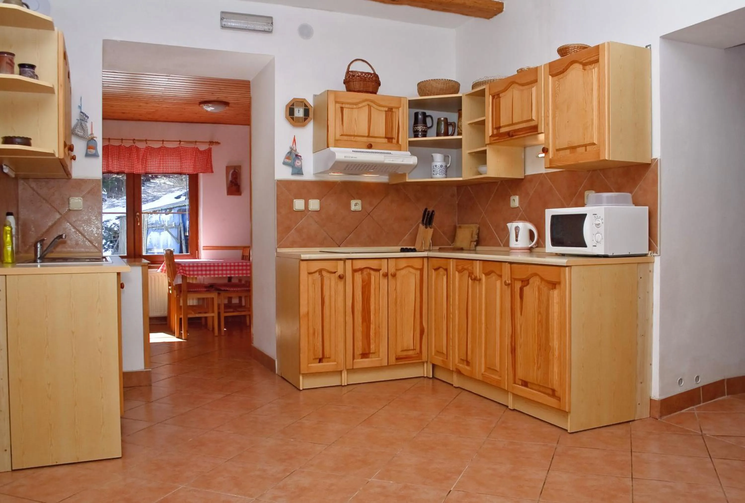 Kitchen or kitchenette in Penzion u Vodopádu