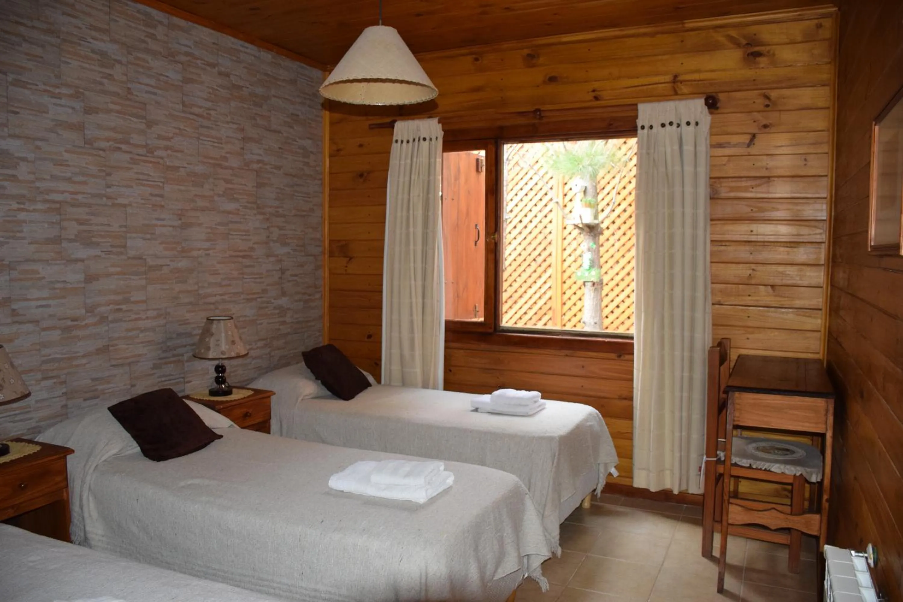 Bed in Hosteria Rukahué