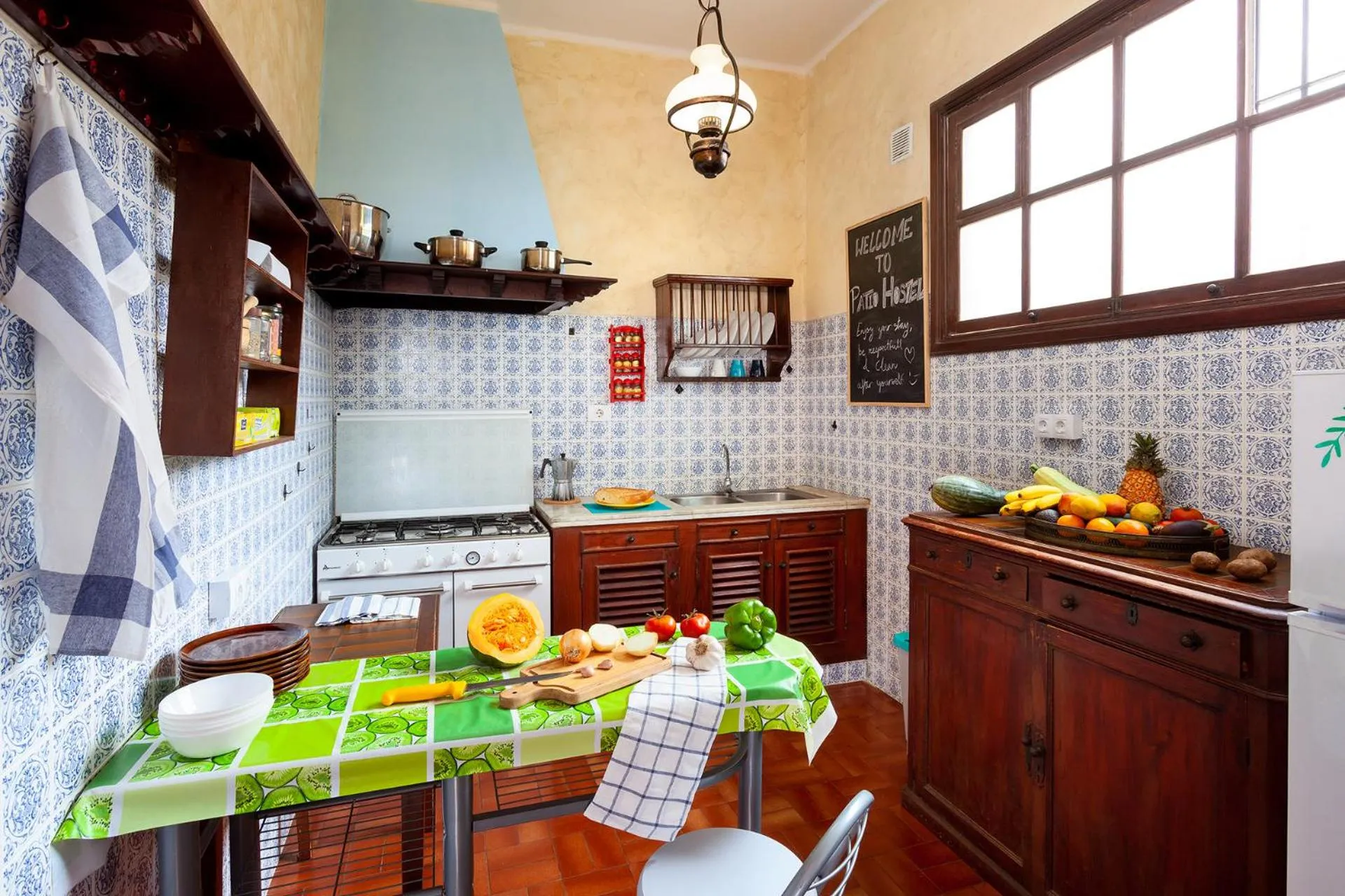 Communal kitchen in Patio Hostel