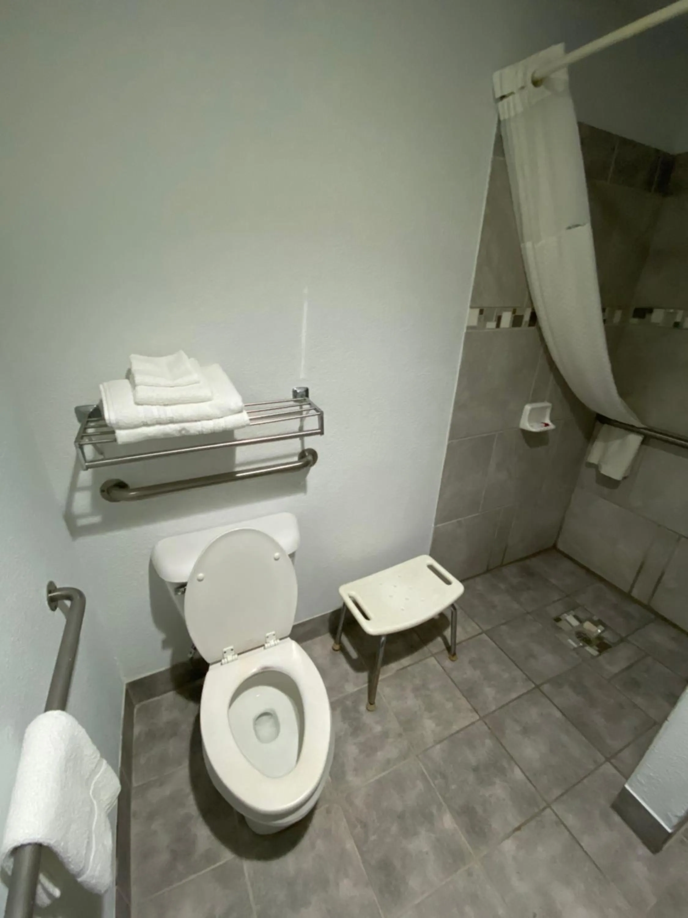 Toilet in Super 8 by Wyndham Metropolis