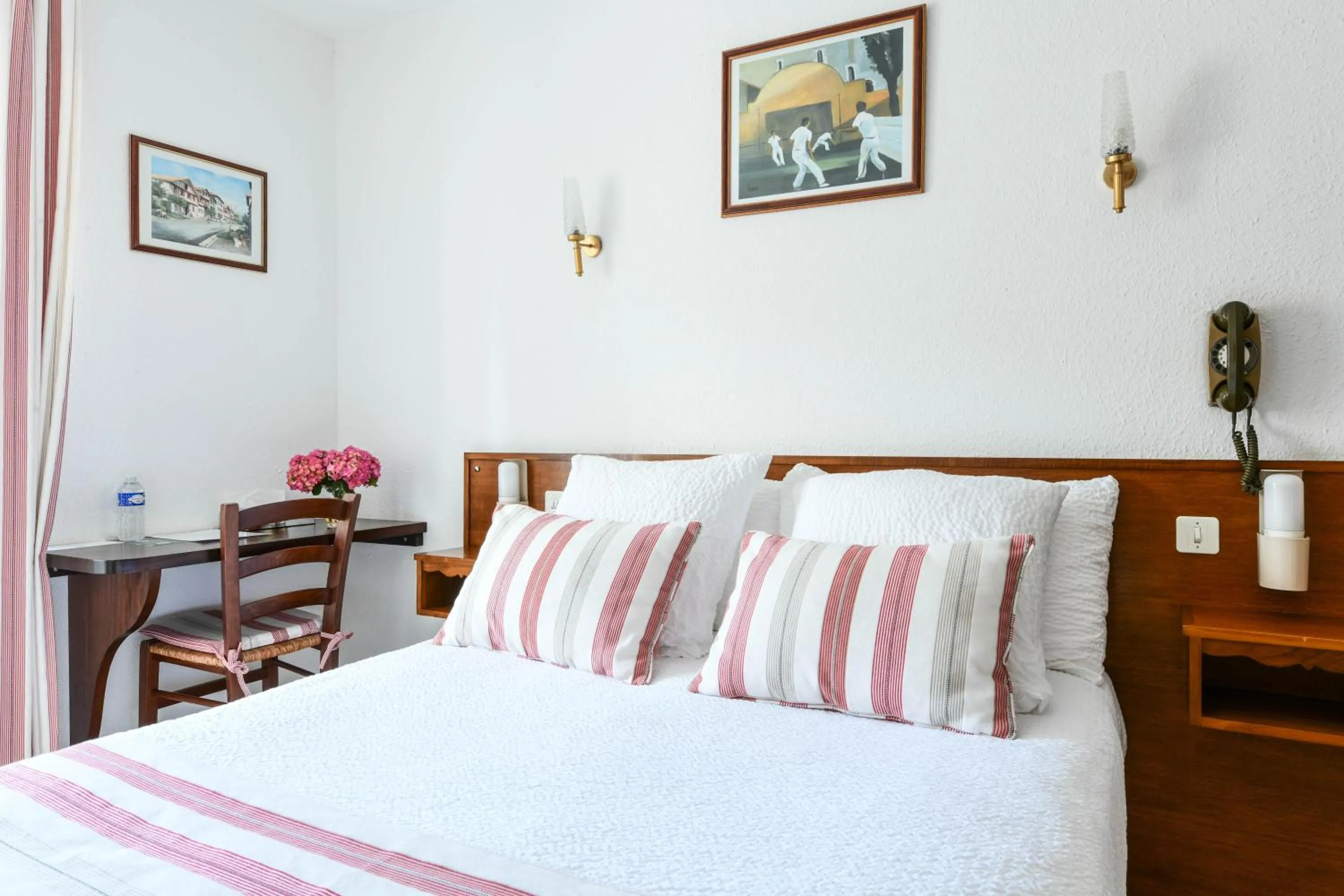 Bed in Logis Hôtel Baratxartea