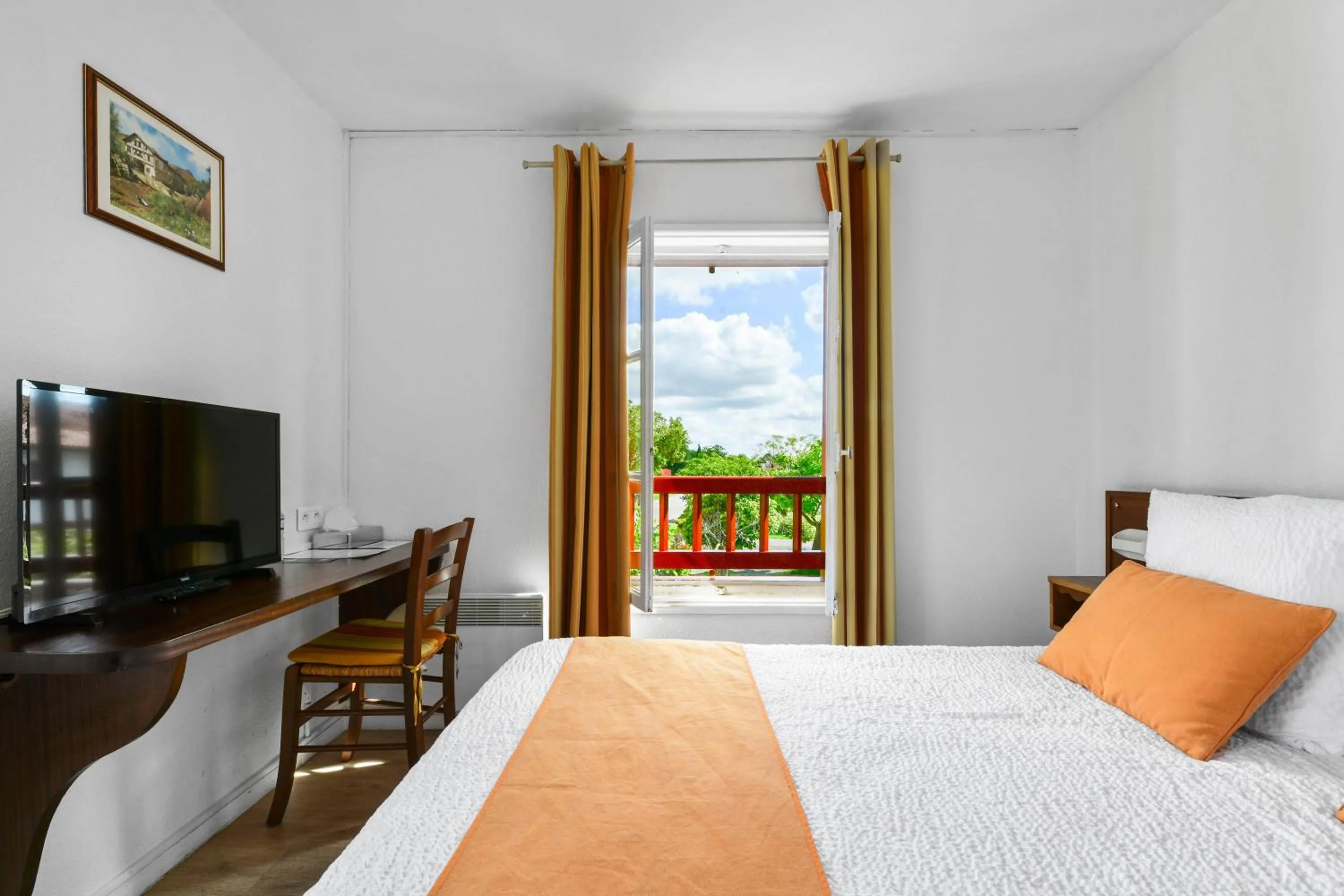 Bed in Logis Hôtel Baratxartea