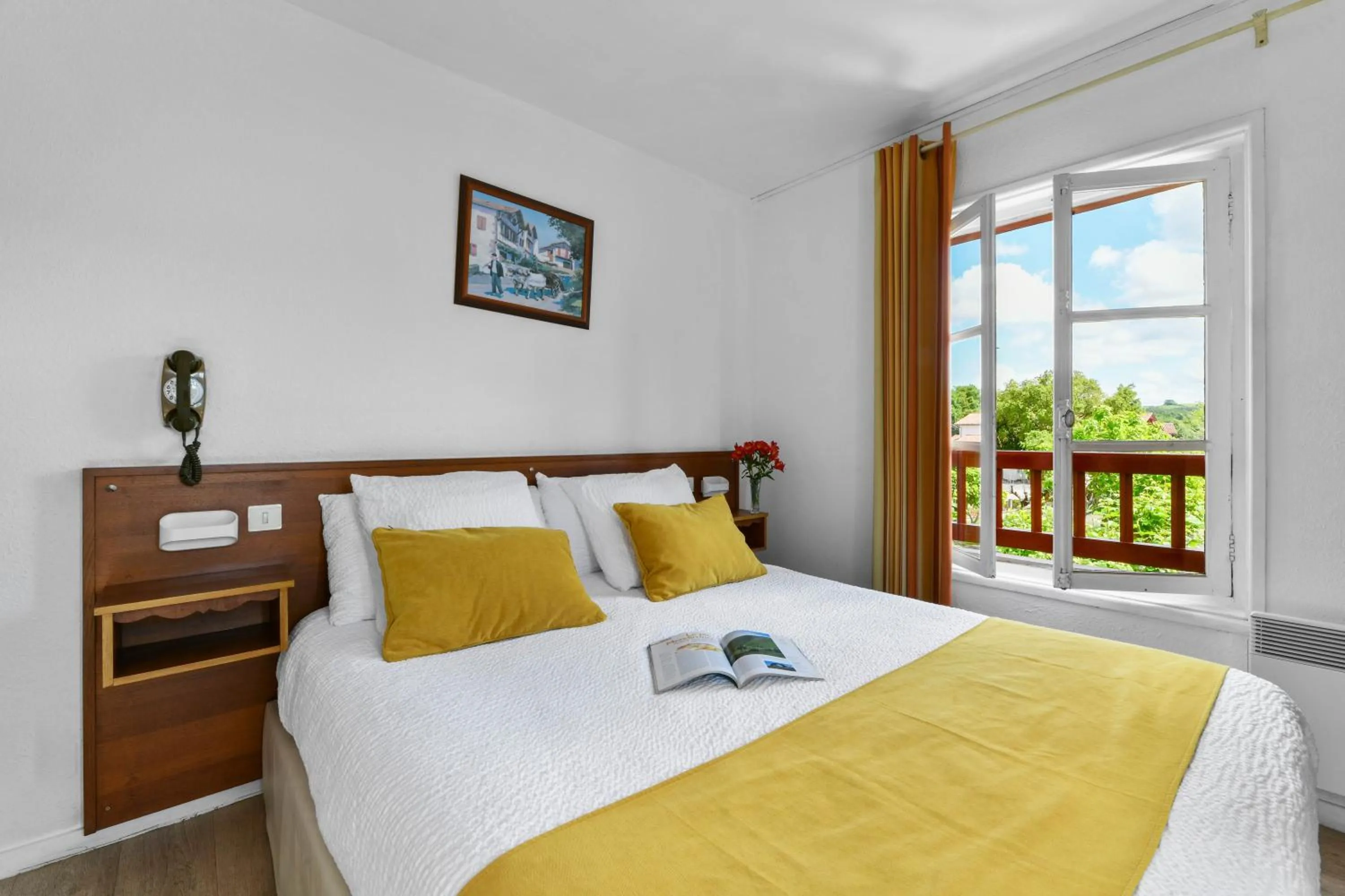 Bed in Logis Hôtel Baratxartea