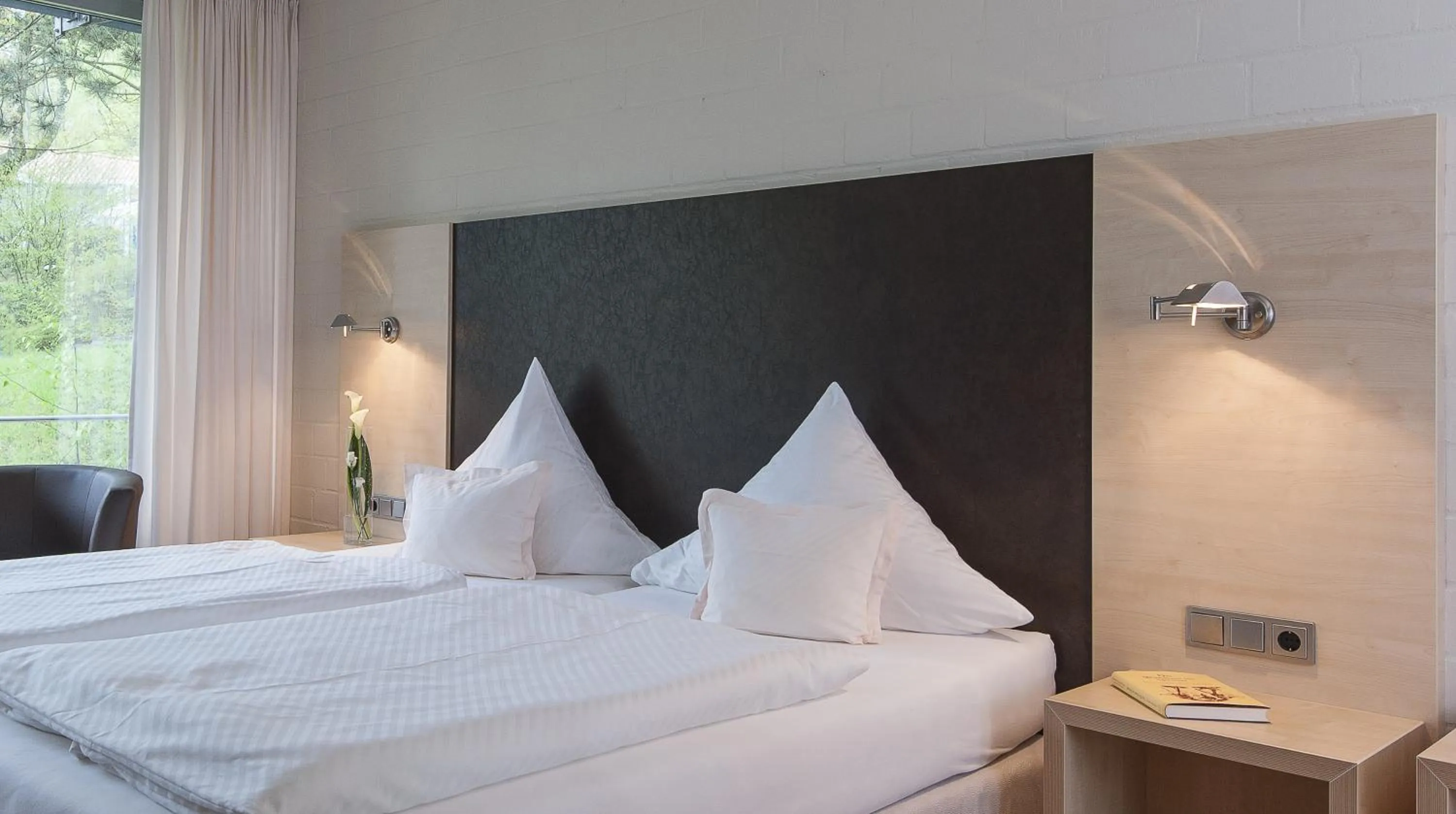 Photo of the whole room, Bed in SeminarZentrum Rückersbach