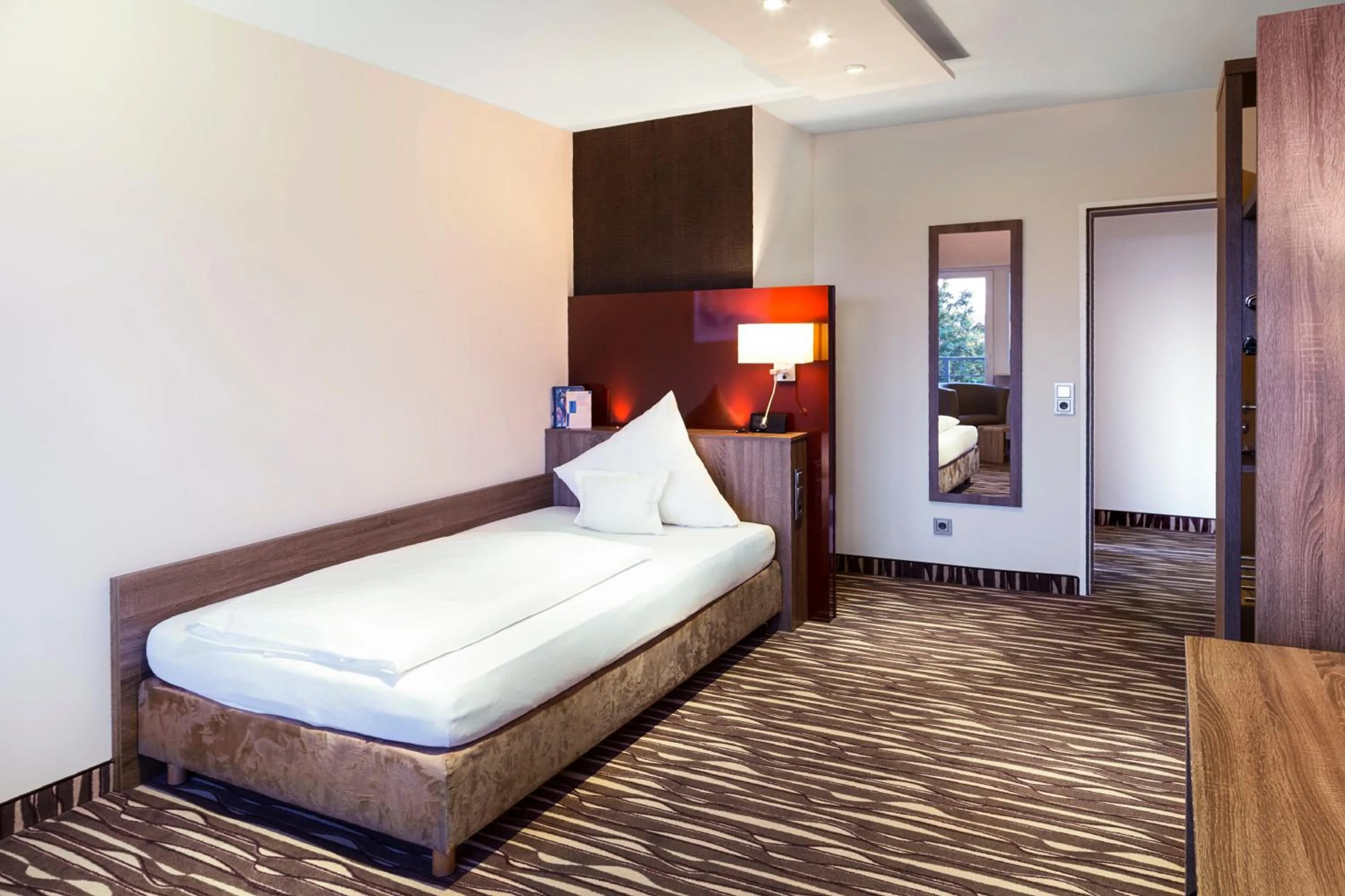 Photo of the whole room, Bed in SeminarZentrum Rückersbach