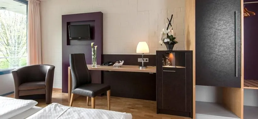 Photo of the whole room, Bed in SeminarZentrum Rückersbach