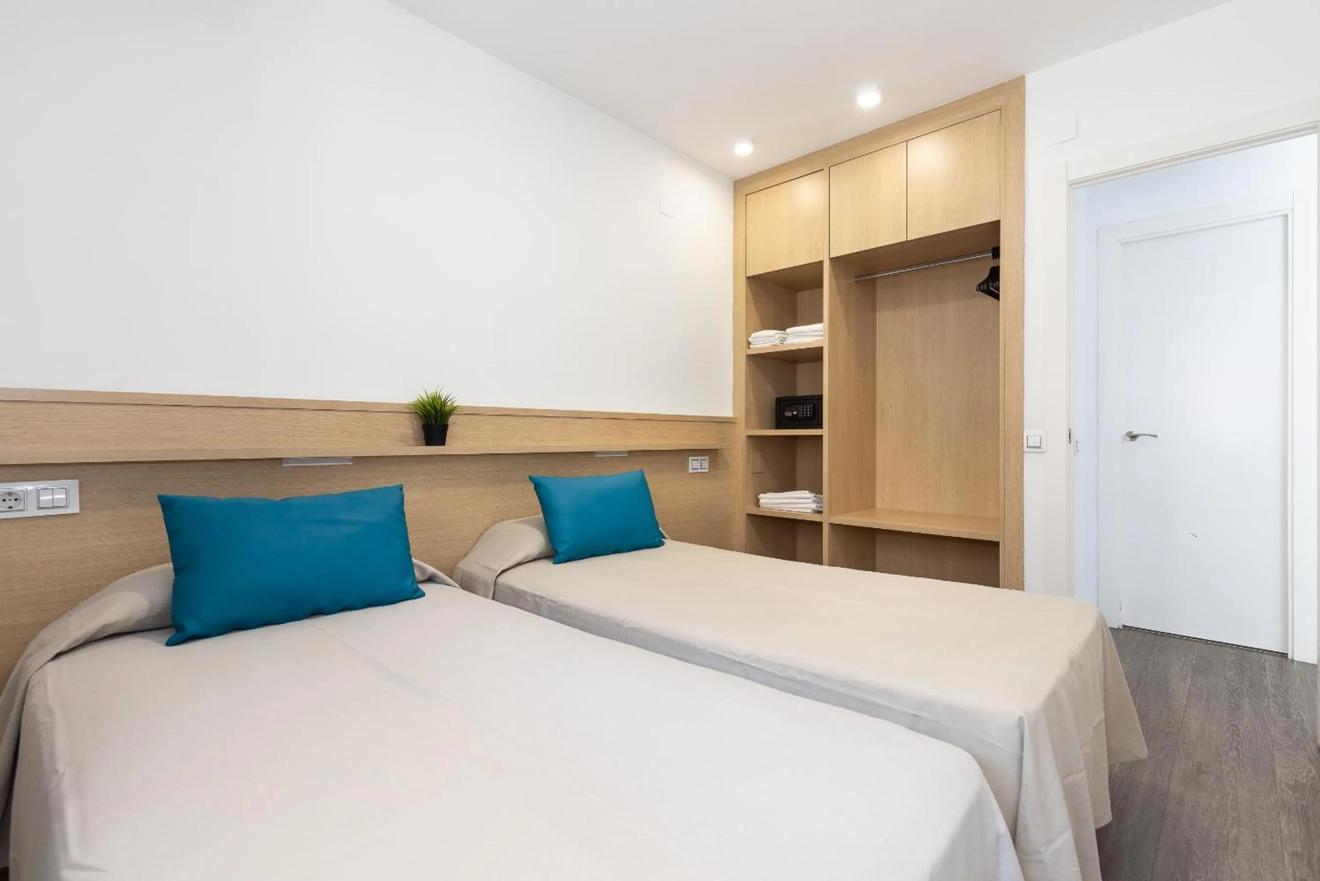 Bed in Rentalmar Zahara family suites