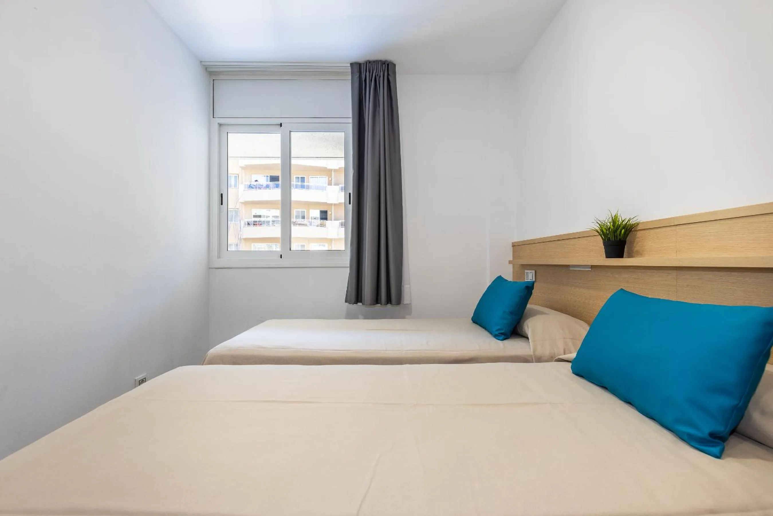 Bed in Rentalmar Zahara family suites