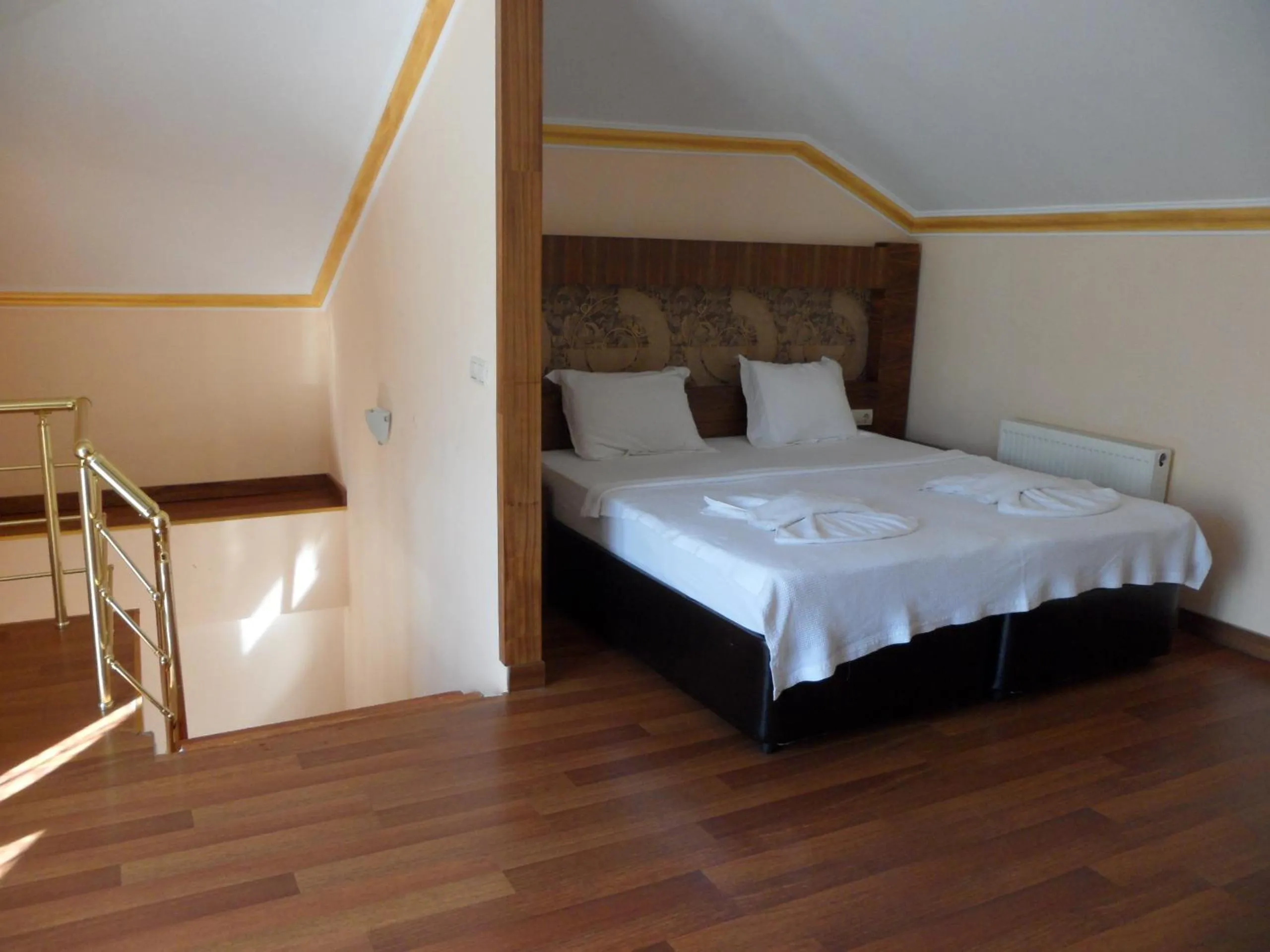 Bed in Dinara Apart Hotel