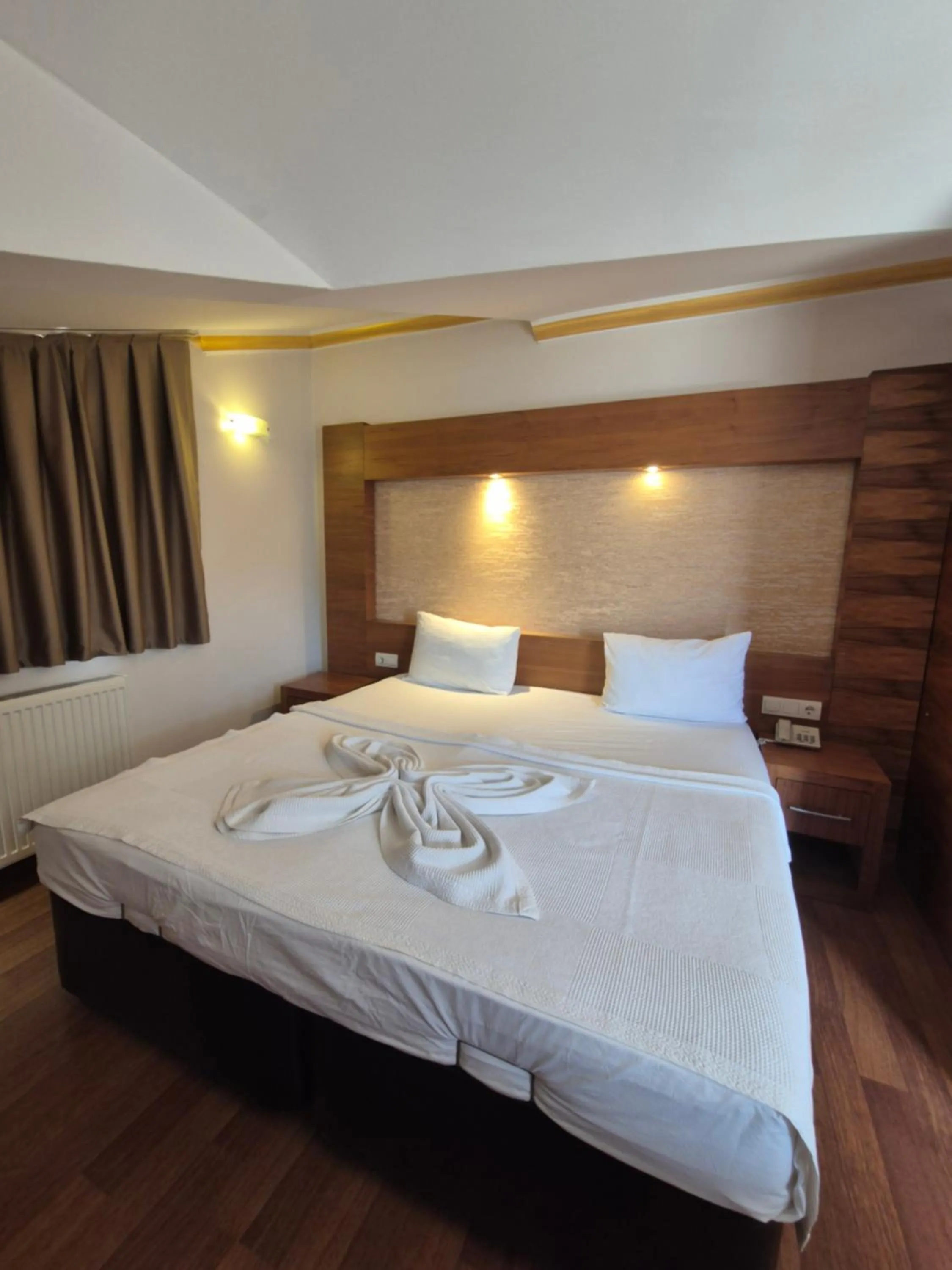Bed in Dinara Apart Hotel