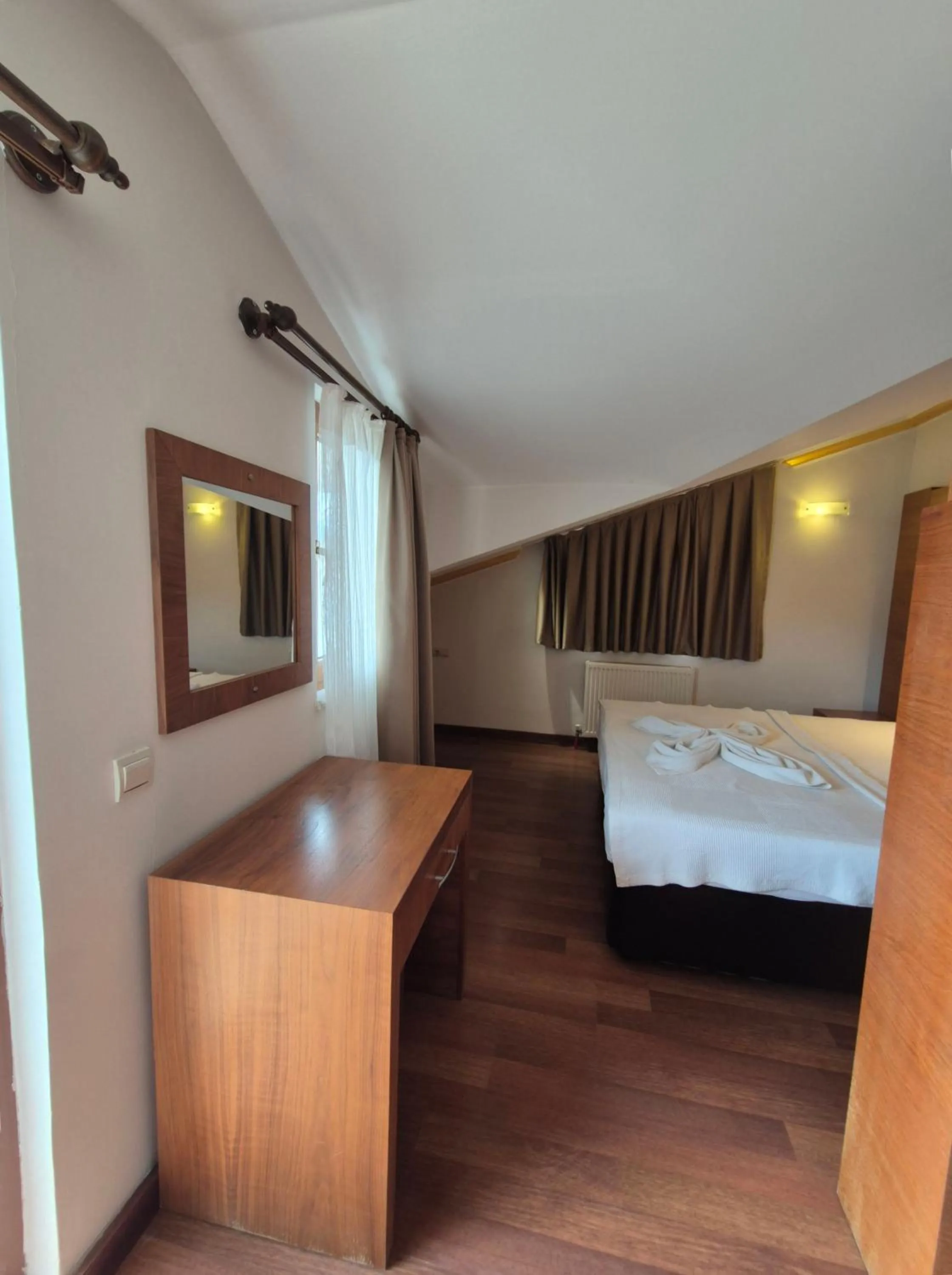 Bed in Dinara Apart Hotel