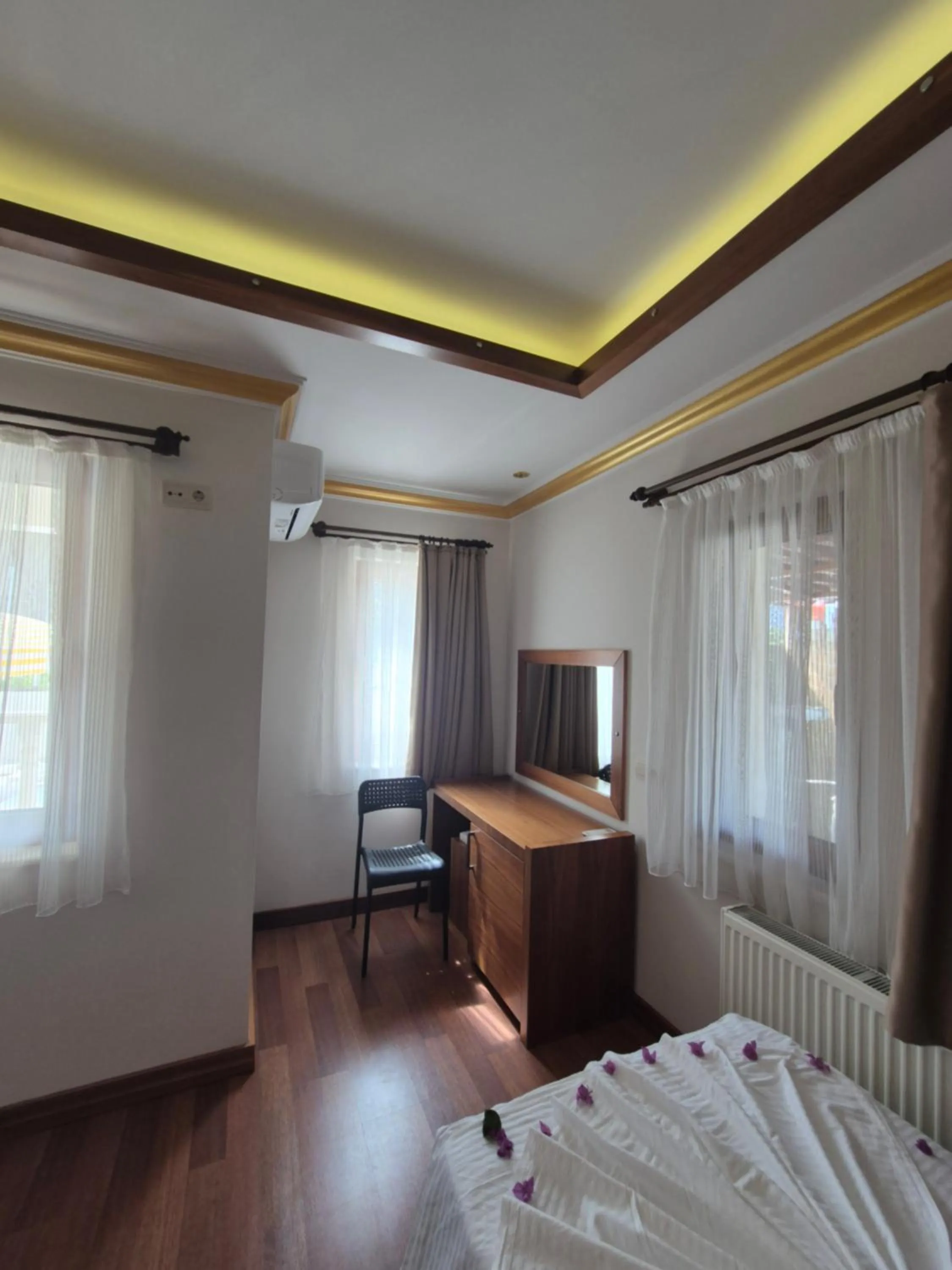 Bedroom in Dinara Apart Hotel