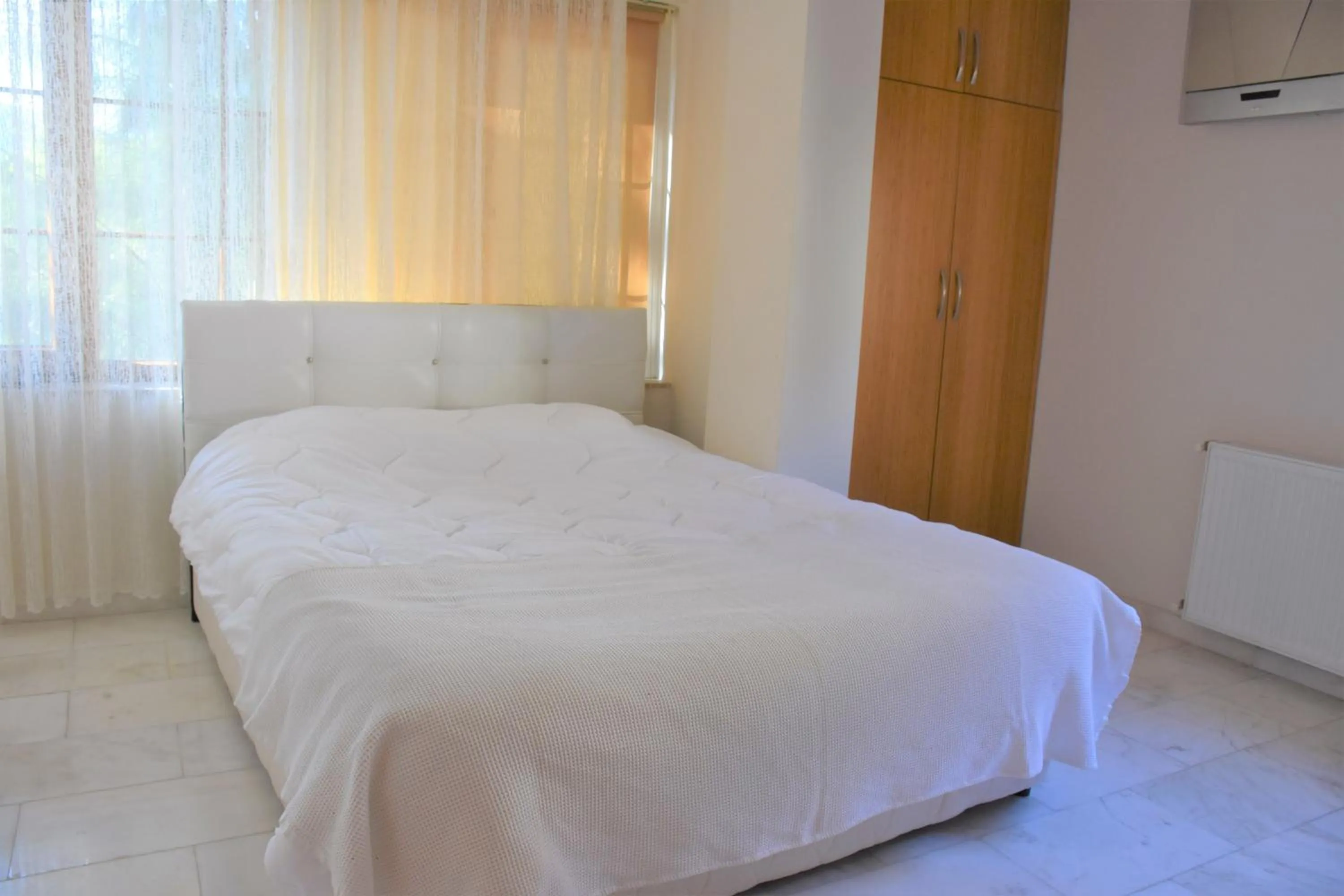 Bed in Dinara Apart Hotel