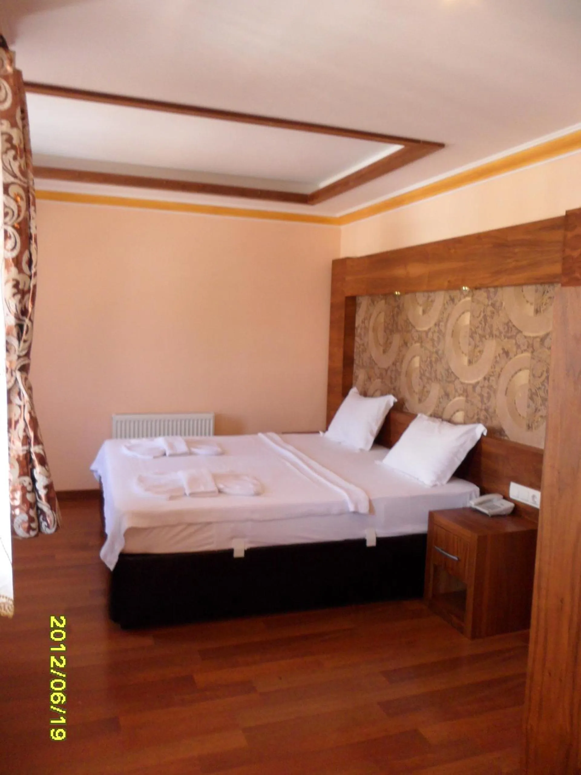 Bed in Dinara Apart Hotel