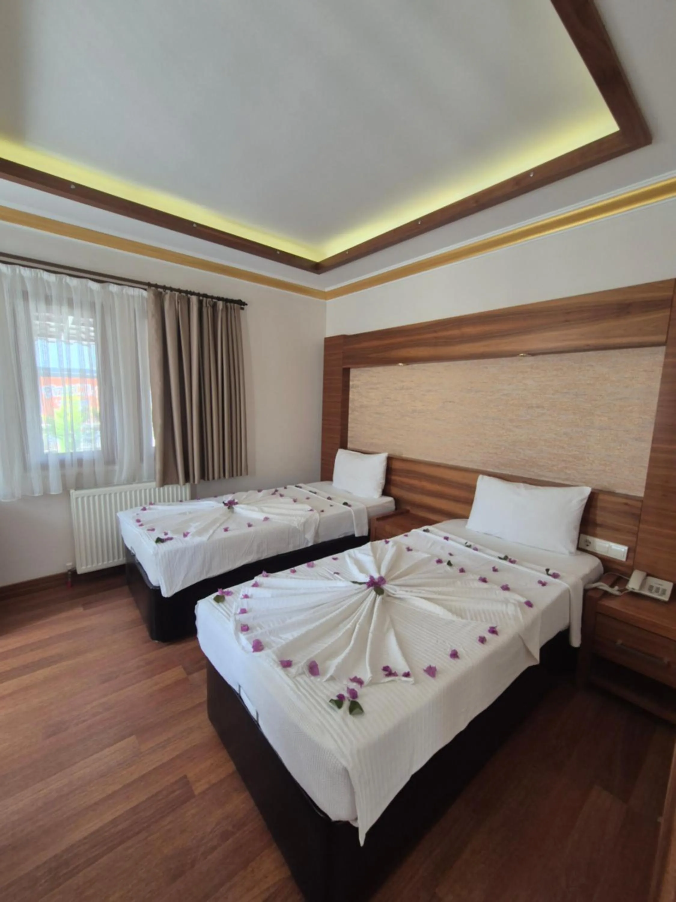 Bed in Dinara Apart Hotel