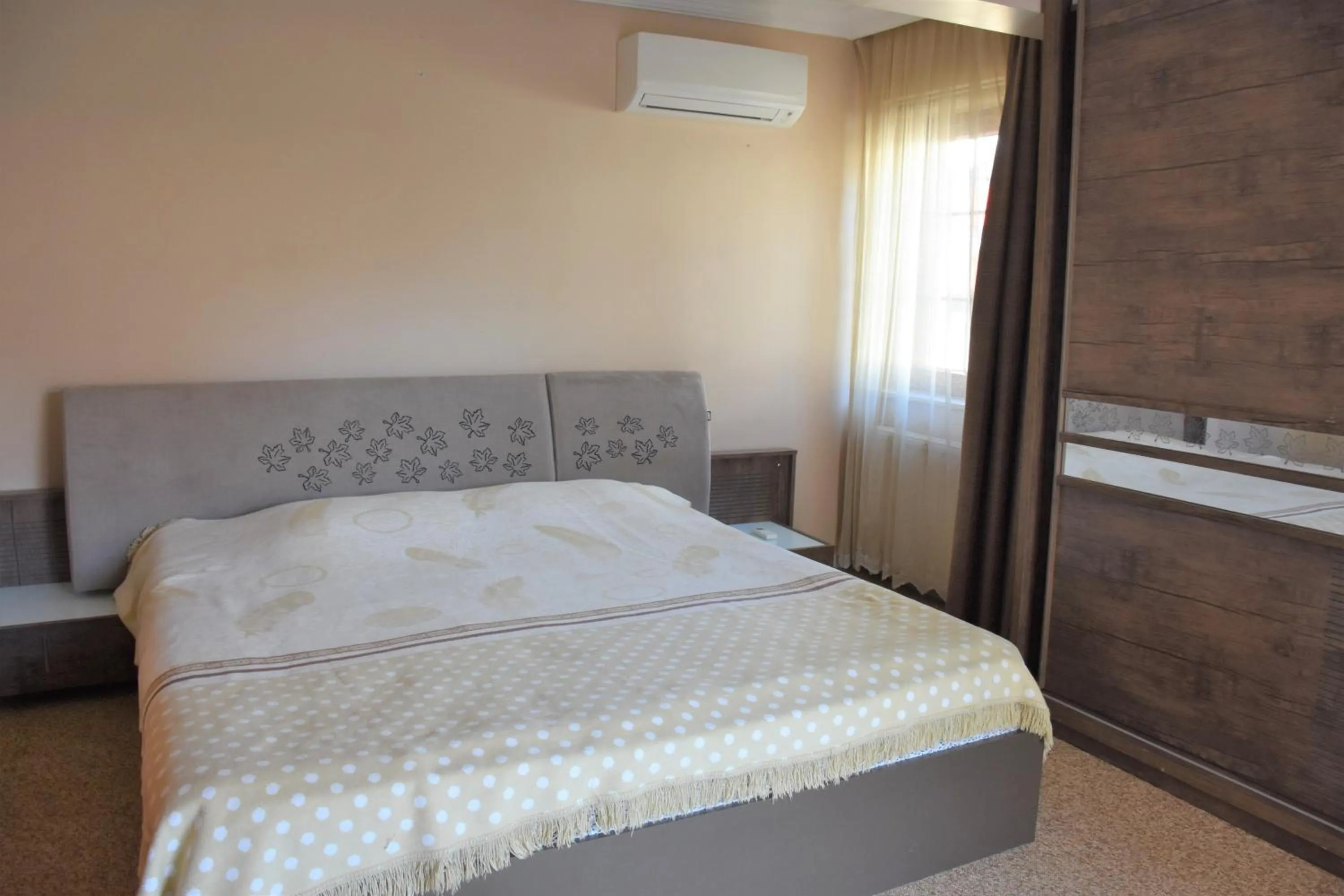 Bedroom in Dinara Apart Hotel