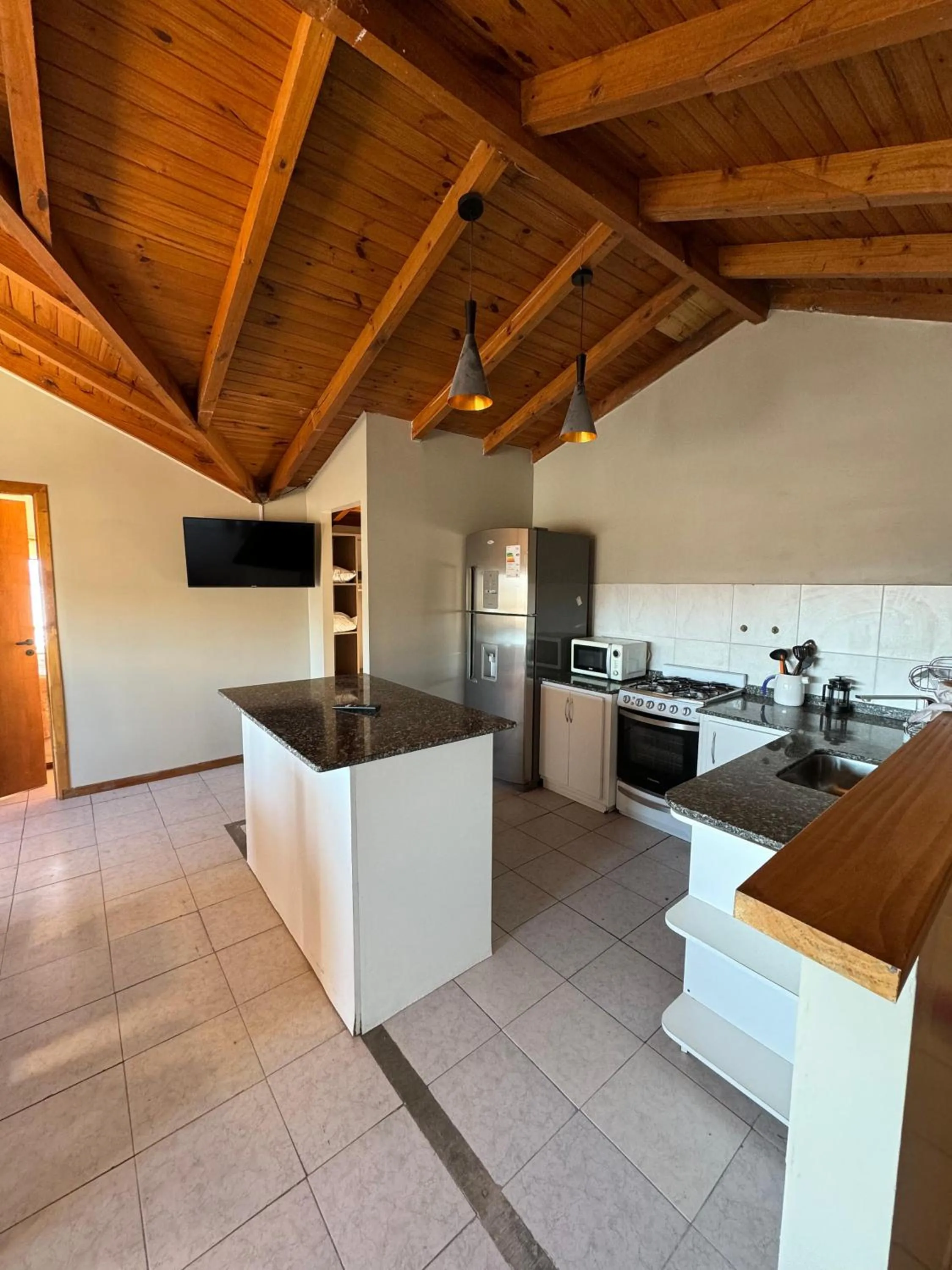 Kitchen or kitchenette in Antu Mahuida Apartments