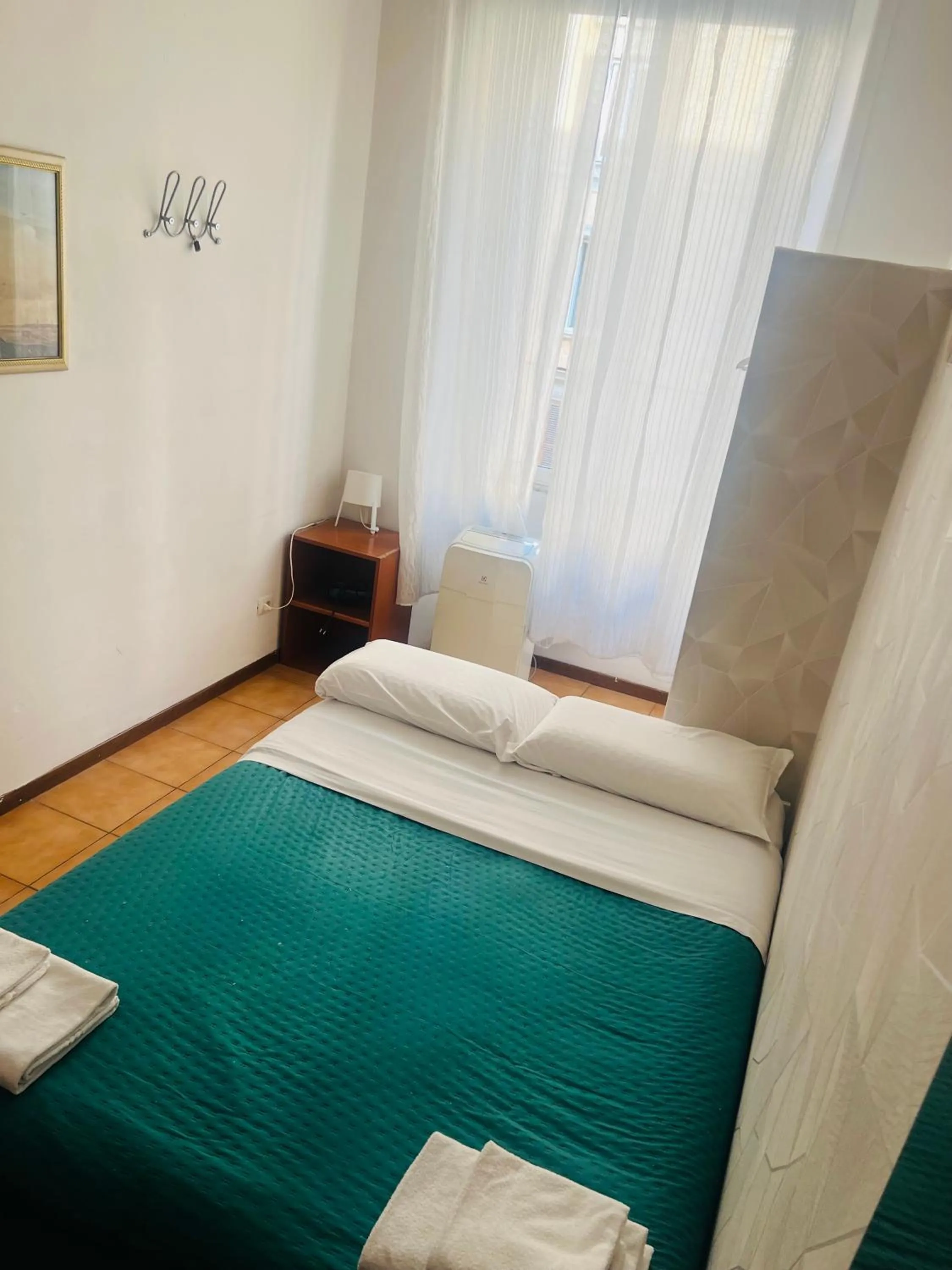 Bed in Meltin' Rome Guest House