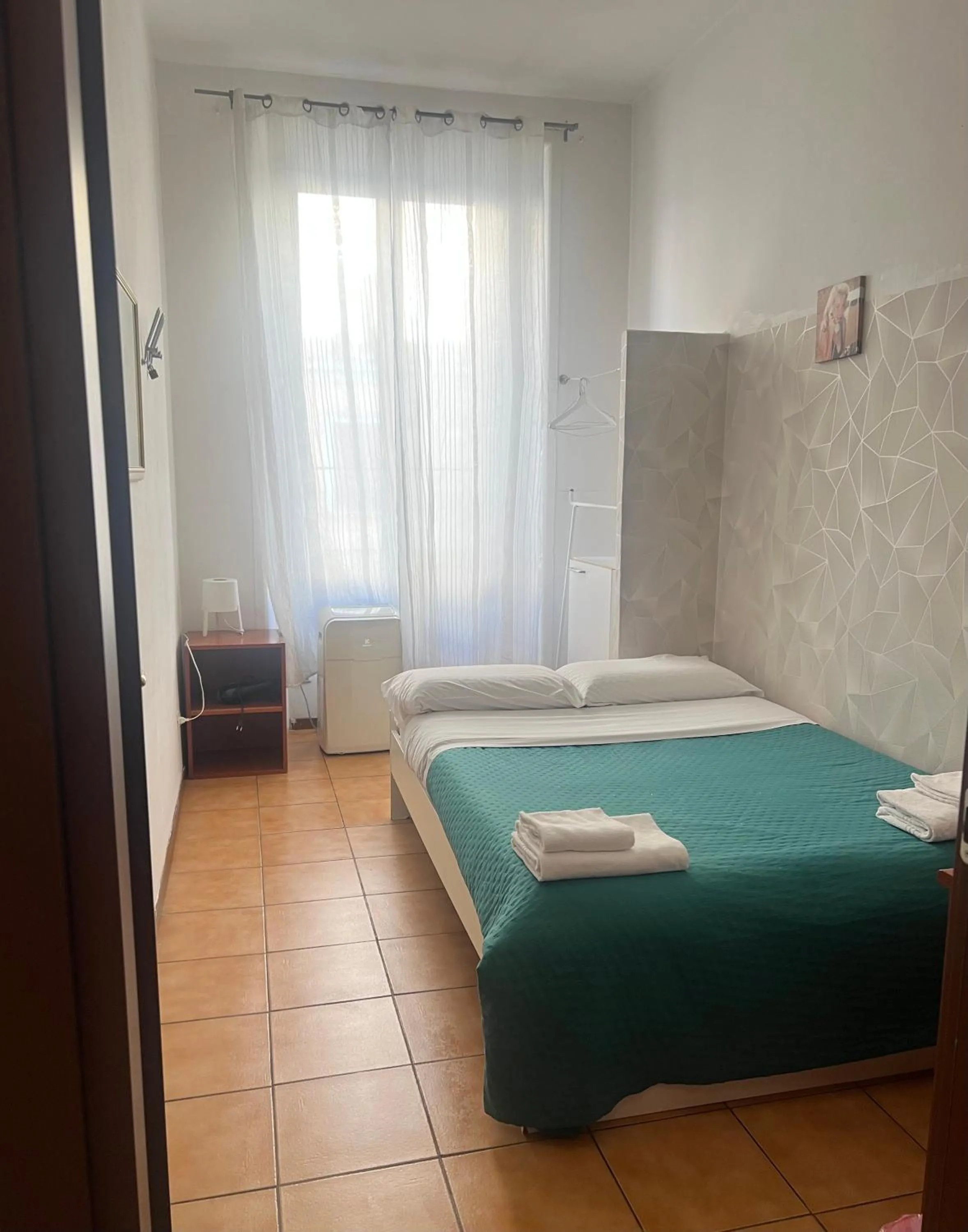 Bed in Meltin' Rome Guest House