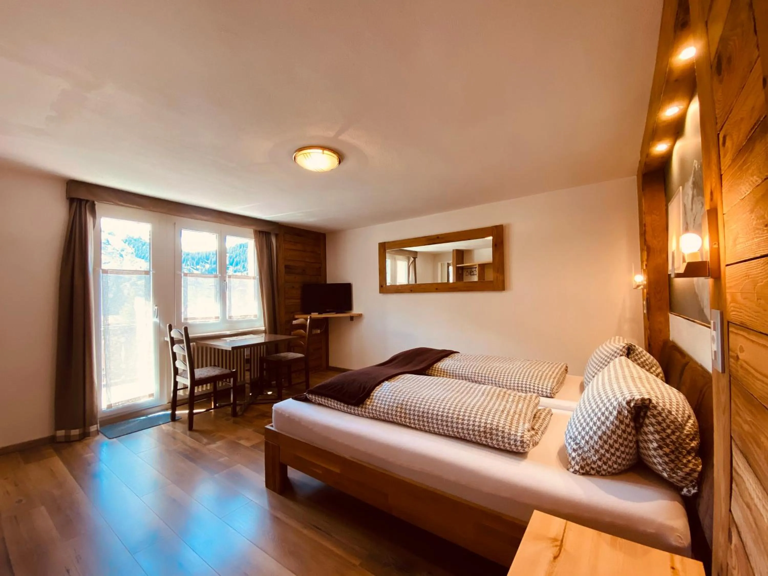 Photo of the whole room, Bed in Mountain Lodge Sedrun