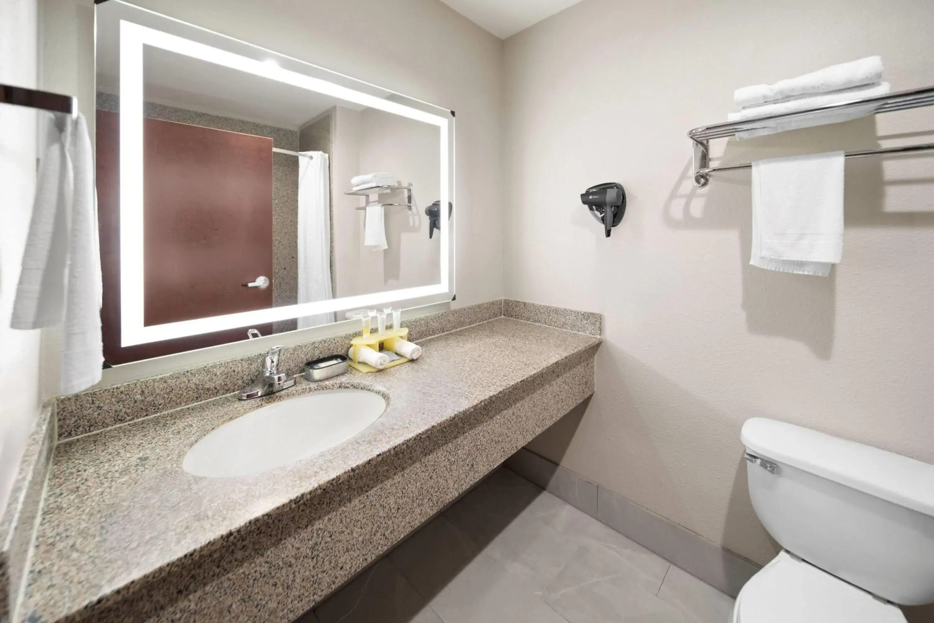 Bathroom in Days Inn & Suites by Wyndham Sam Houston Tollway Bathroom in Days Inn & Suites by Wyndham Sam Houston Tollway