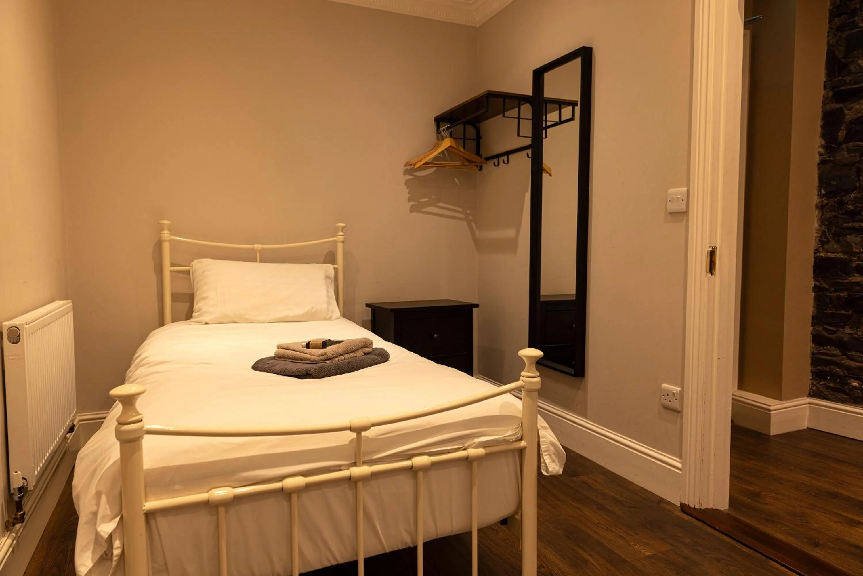 Bed in Molloys Apartments