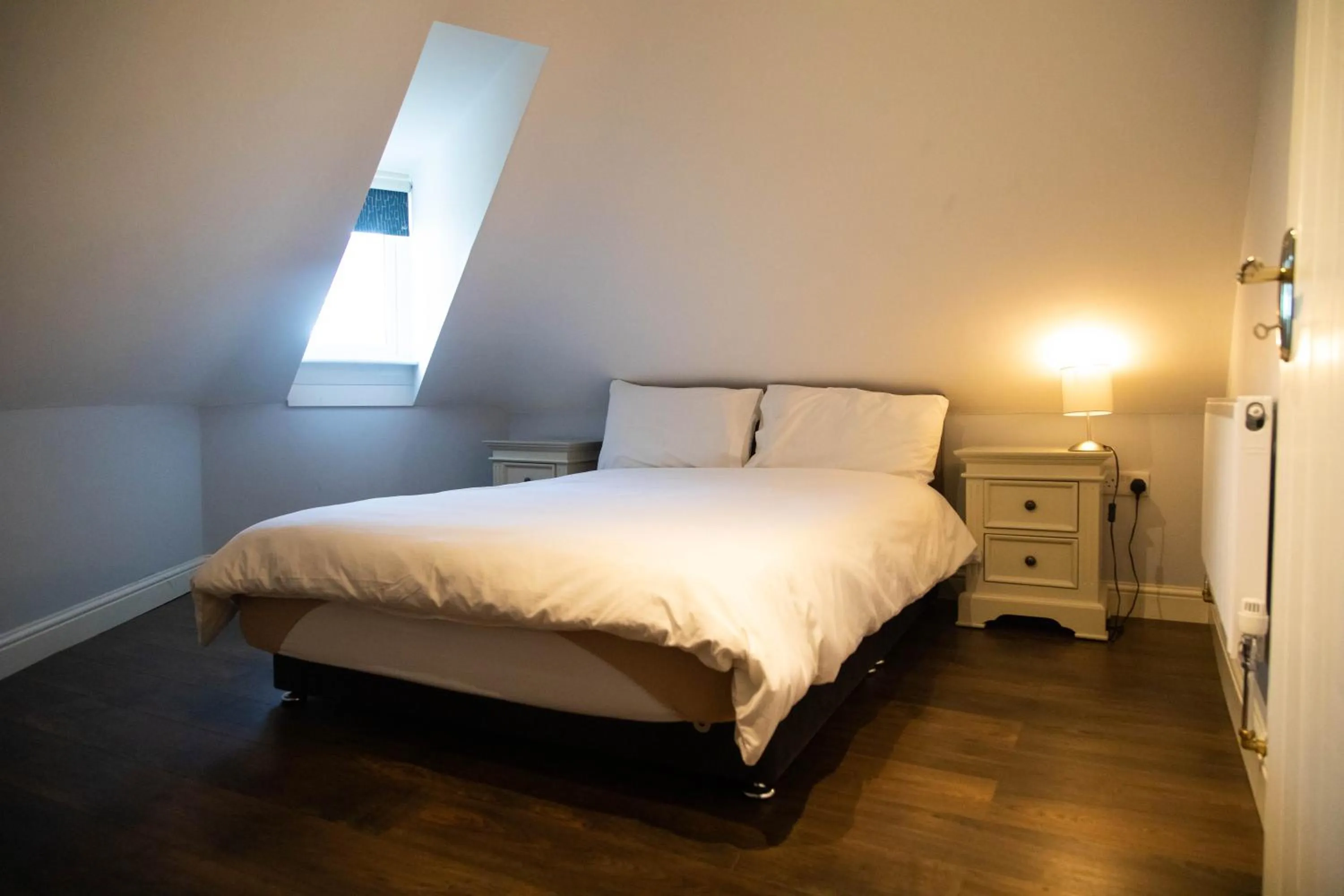 Bed in Molloys Apartments