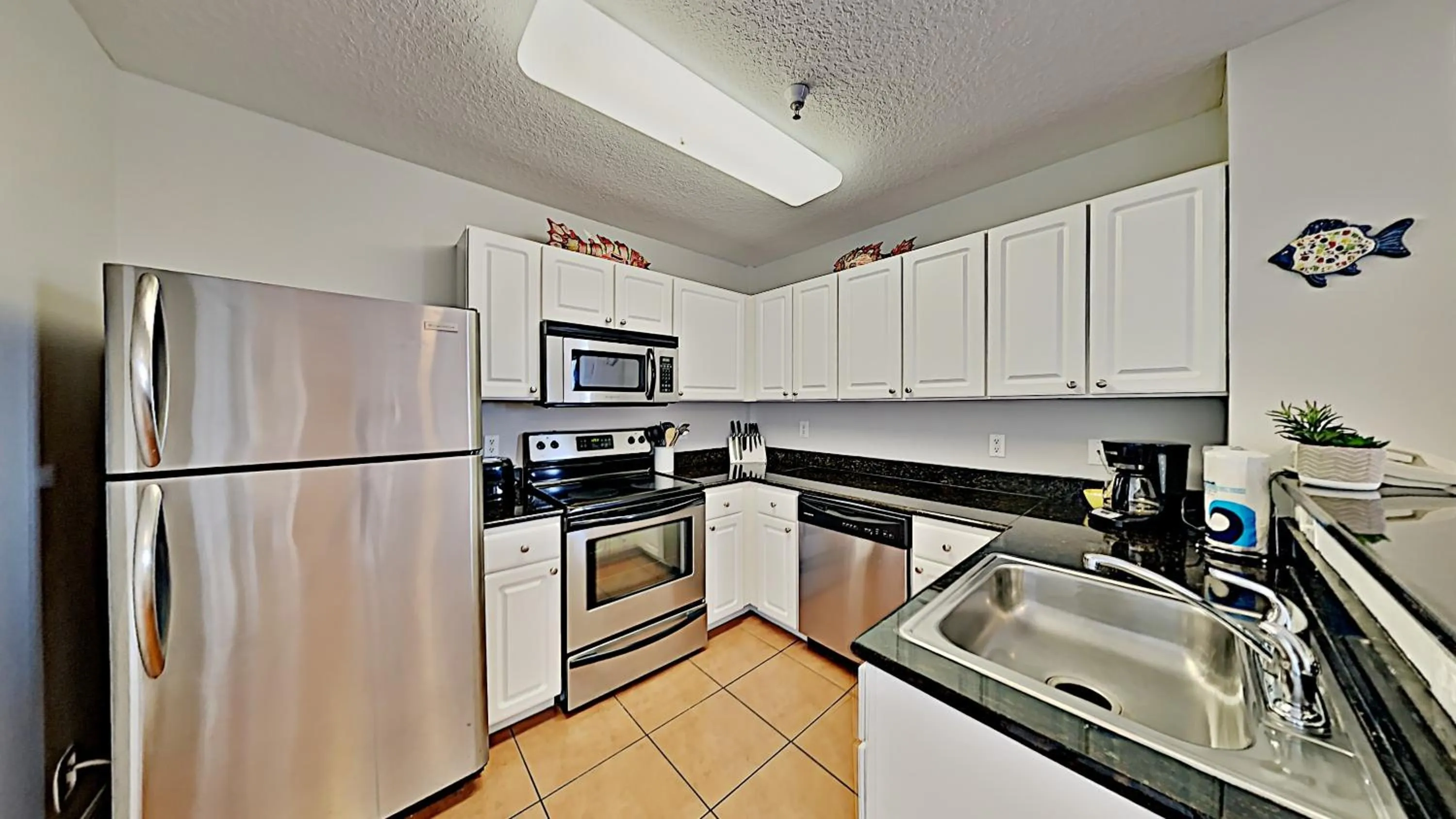 Kitchen or kitchenette in Madeira Bay Resort II by Travel Resort Services