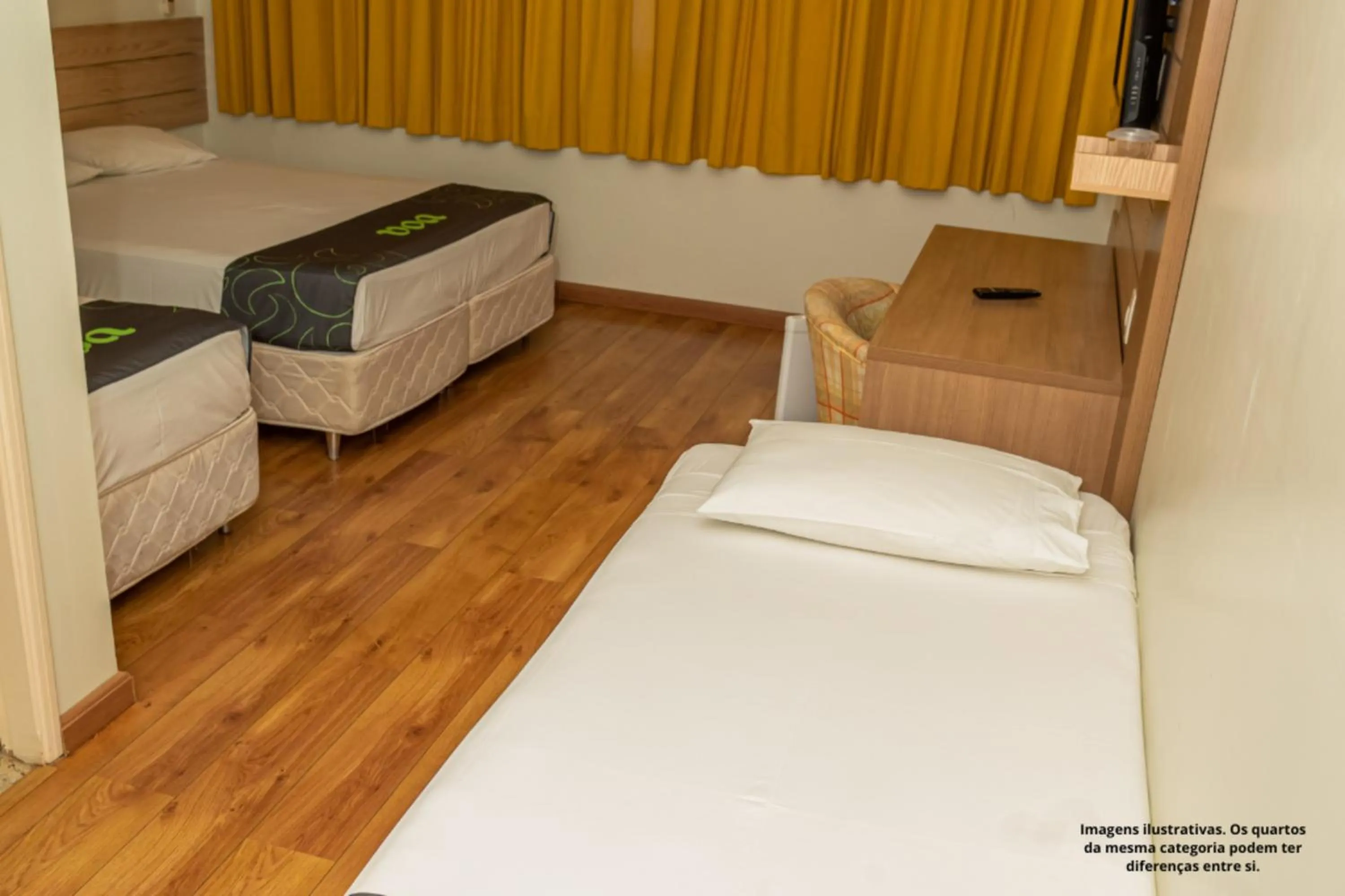 Photo of the whole room, Bed in VOA Hotel Caxambu