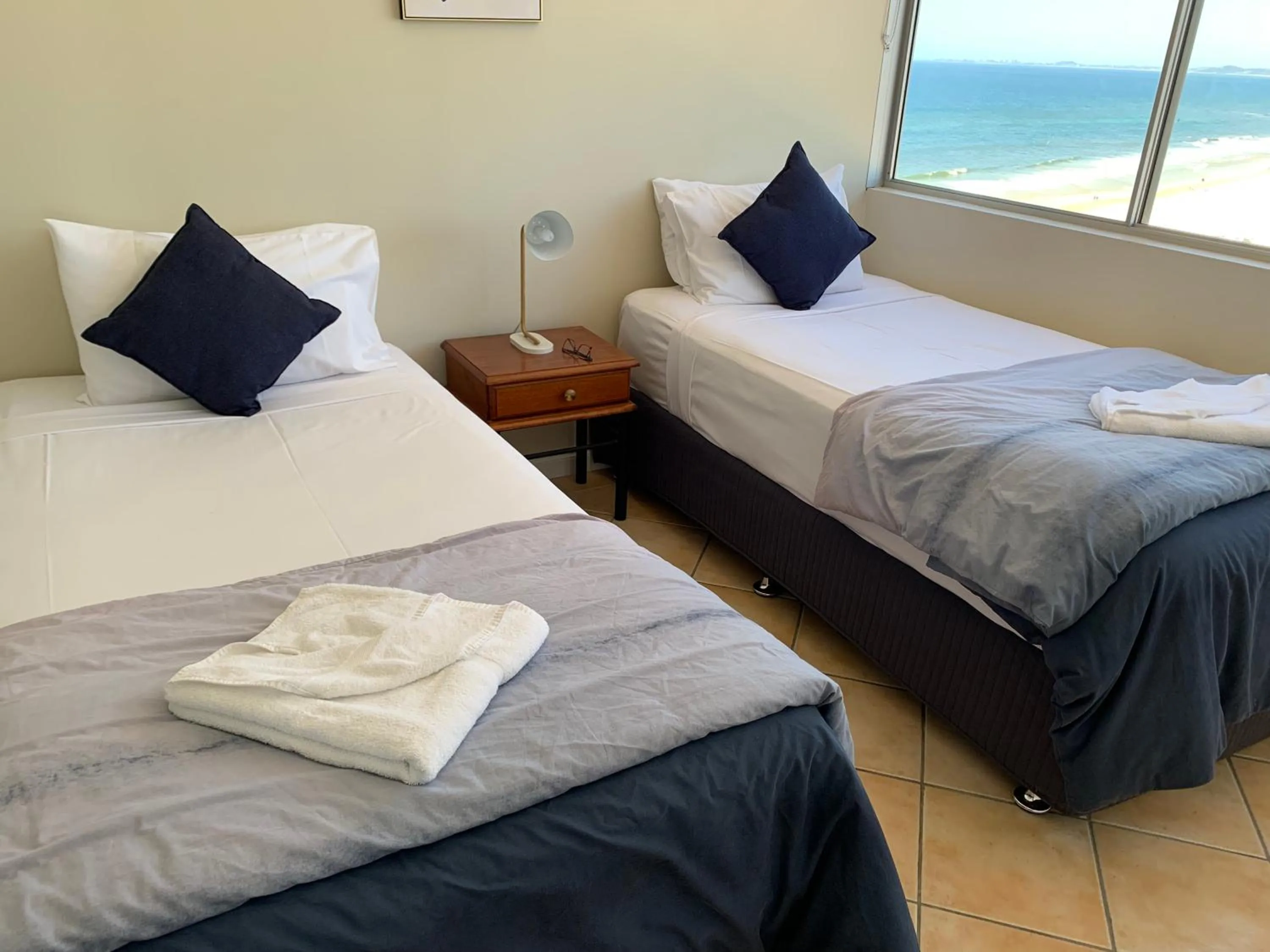 Bed in The Penthouses Apartments